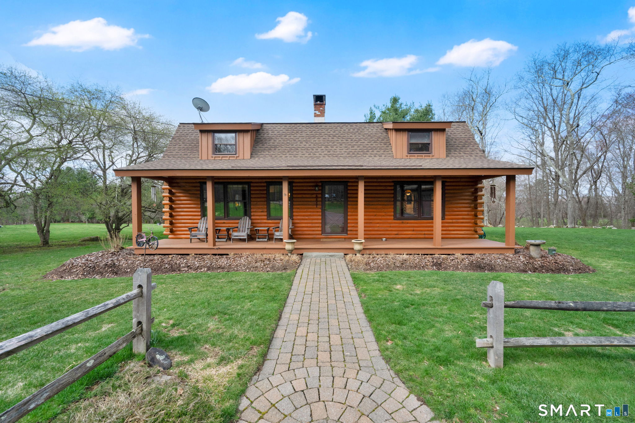 a view of a house with backyard porch and sitting area
