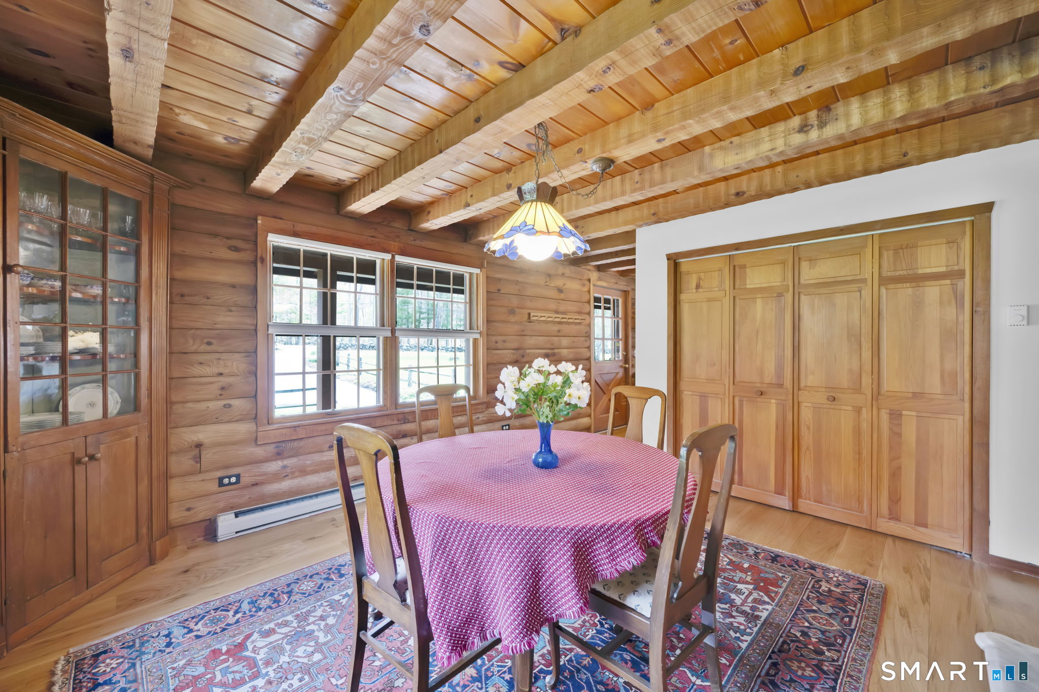 260 West Street Hebron, CT 06248 - Photo 14 of 40 a view of a dining room with furniture window and wooden floor