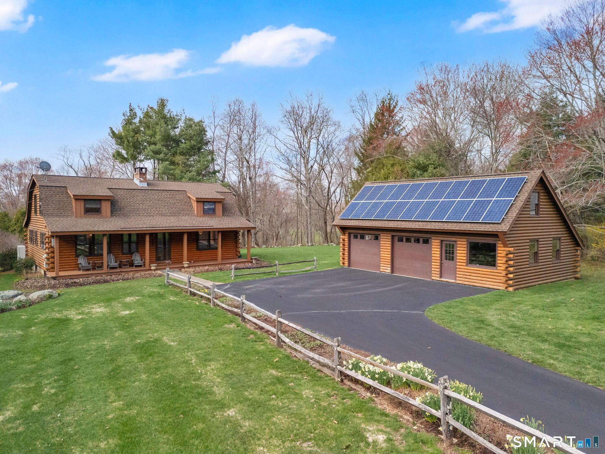 260 West Street Hebron, CT 06248 - Photo 2 of 40 a view of a big house with a big yard and large trees