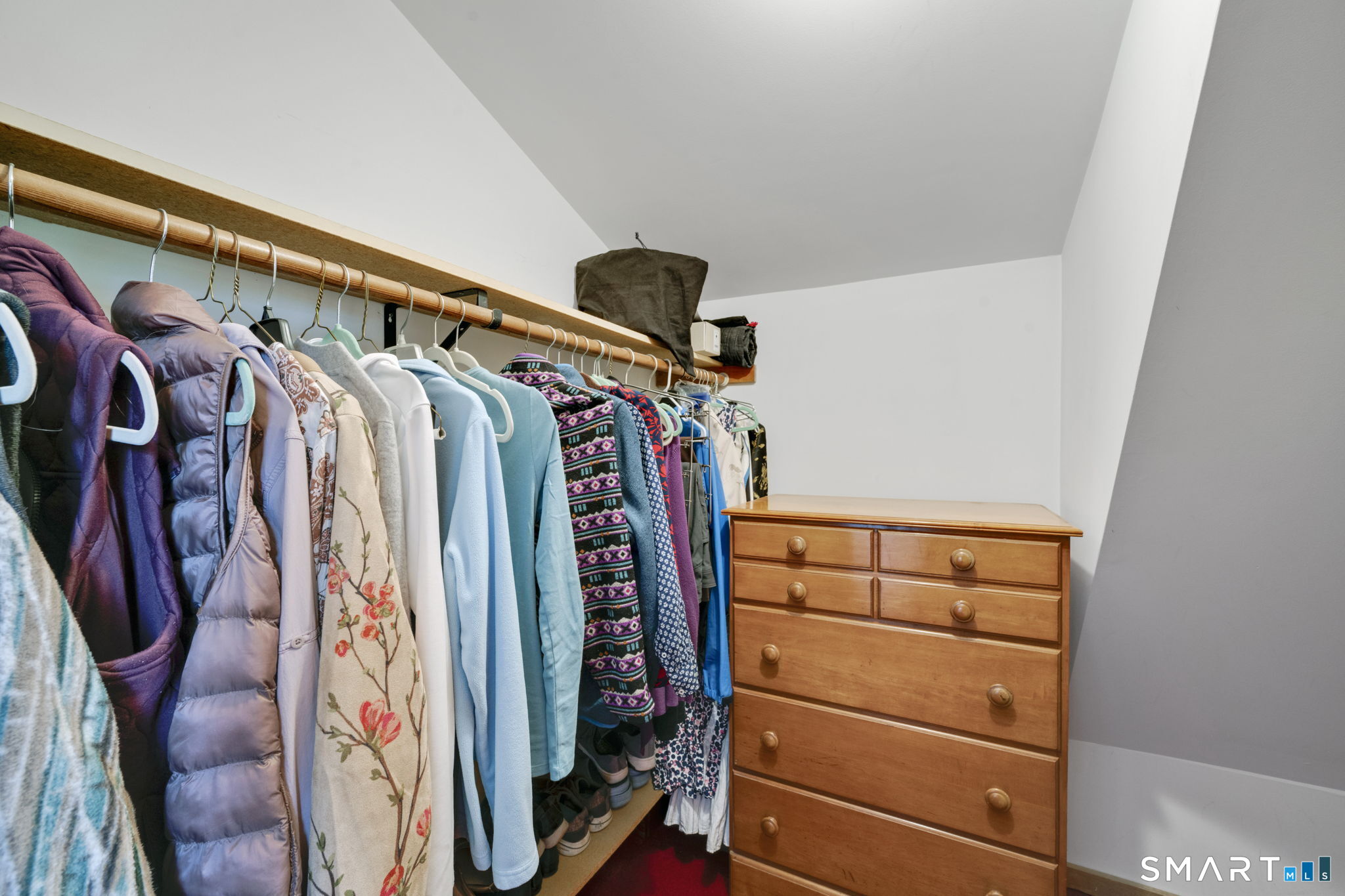 260 West Street Hebron, CT 06248 - Photo 23 of 40 a view of walk in closet with clothes and shoes