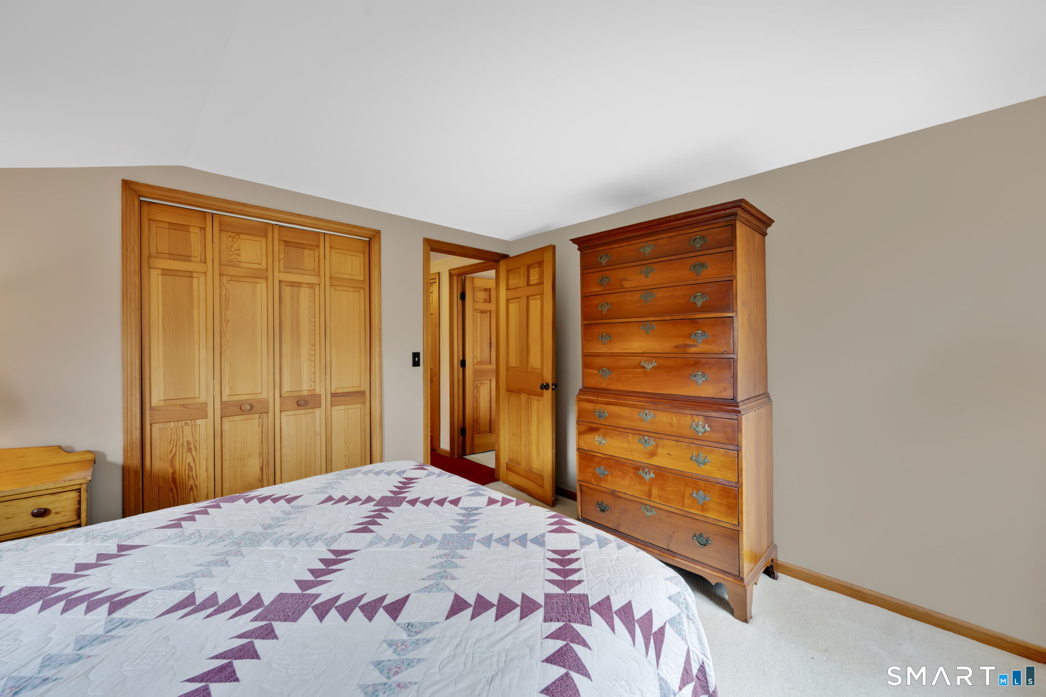 260 West Street Hebron, CT 06248 - Photo 25 of 40 a bedroom with a bed and a window