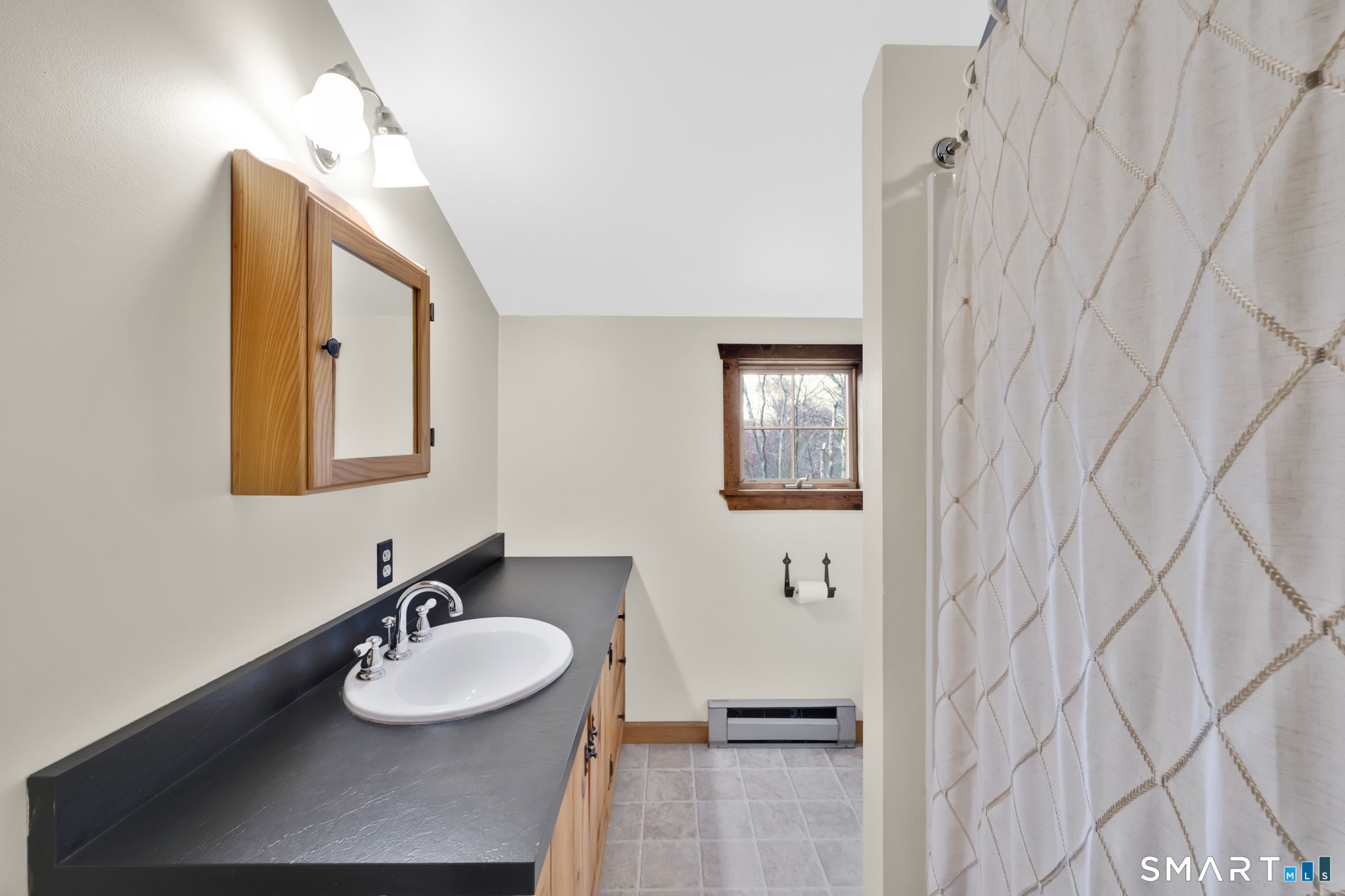 260 West Street Hebron, CT 06248 - Photo 28 of 40 a bathroom with a sink vanity and mirror