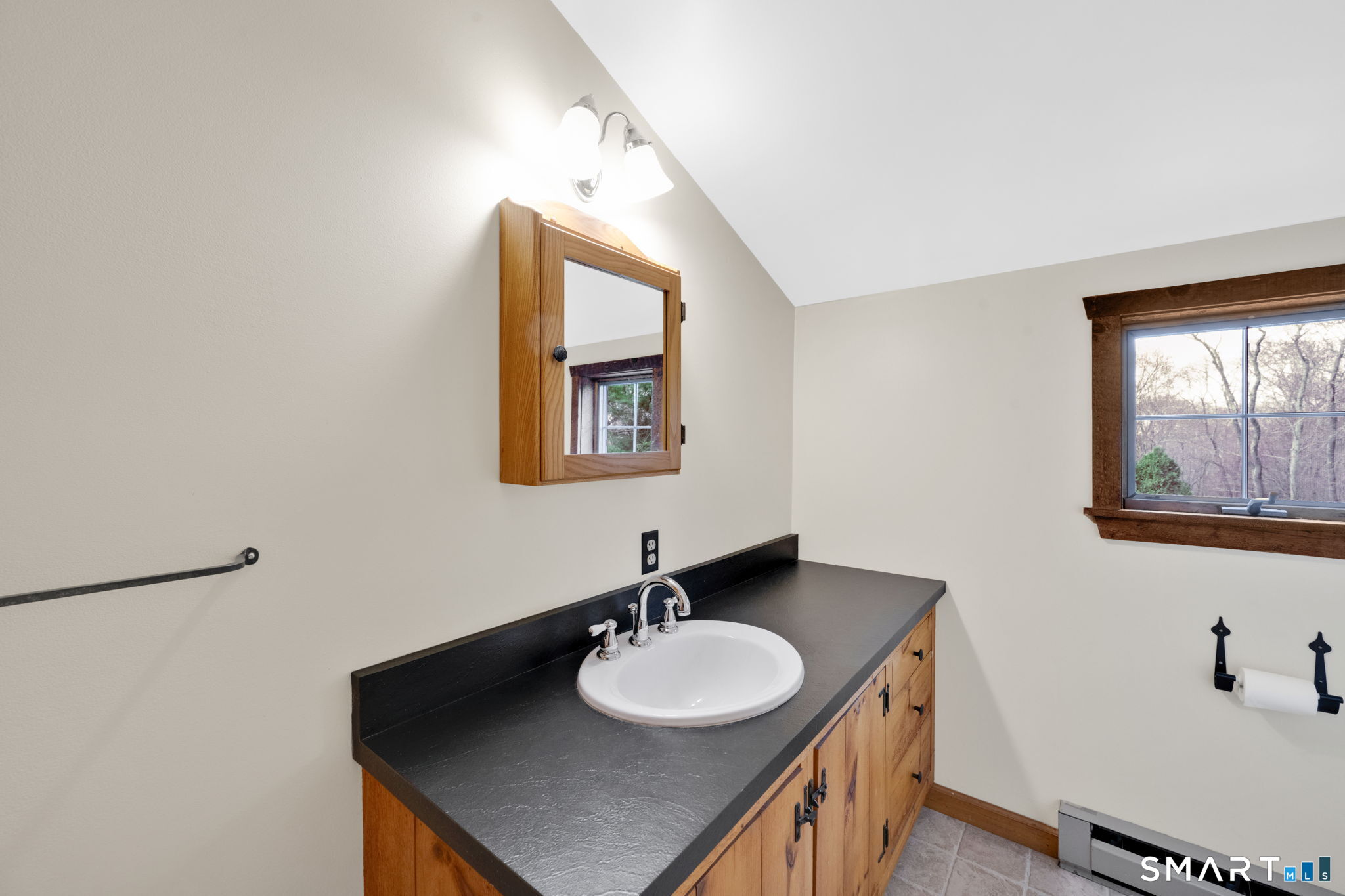 260 West Street Hebron, CT 06248 - Photo 29 of 40 a bathroom with a sink and a mirror