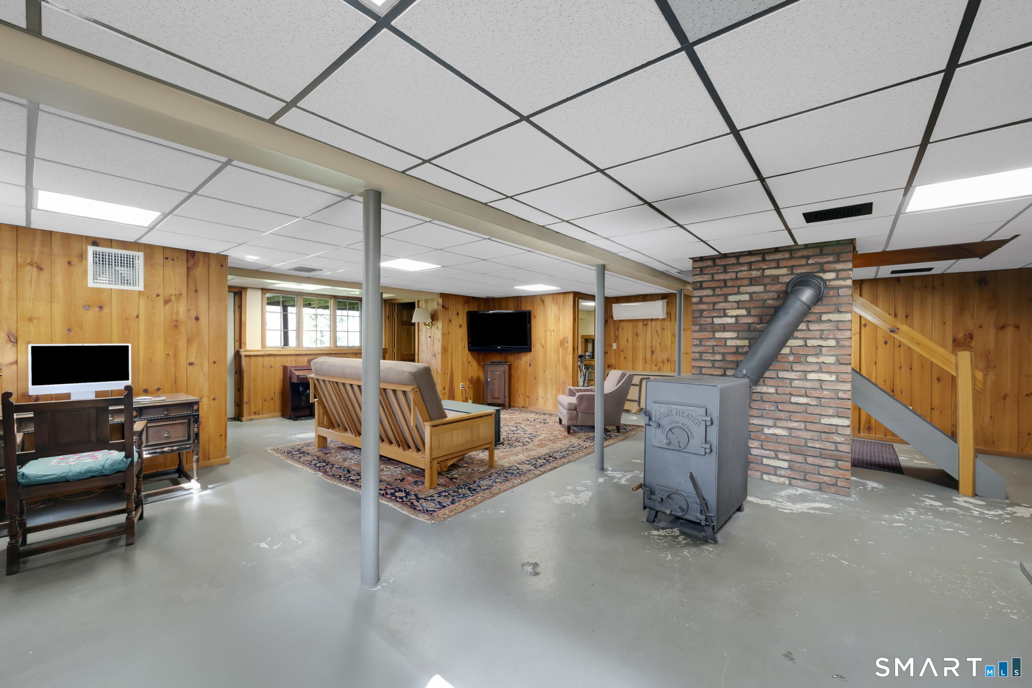 260 West Street Hebron, CT 06248 - Photo 31 of 40 a living room with furniture gym equipment and a large window