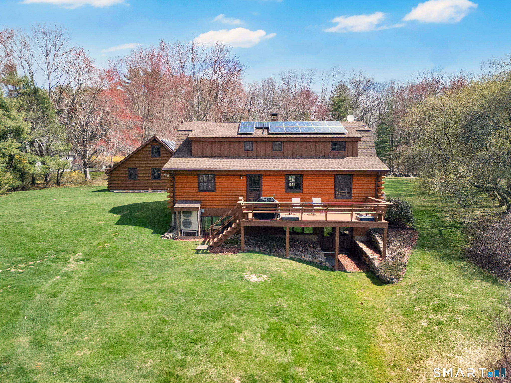 260 West Street Hebron, CT 06248 - Photo 39 of 40 a view of a house with patio and a yard