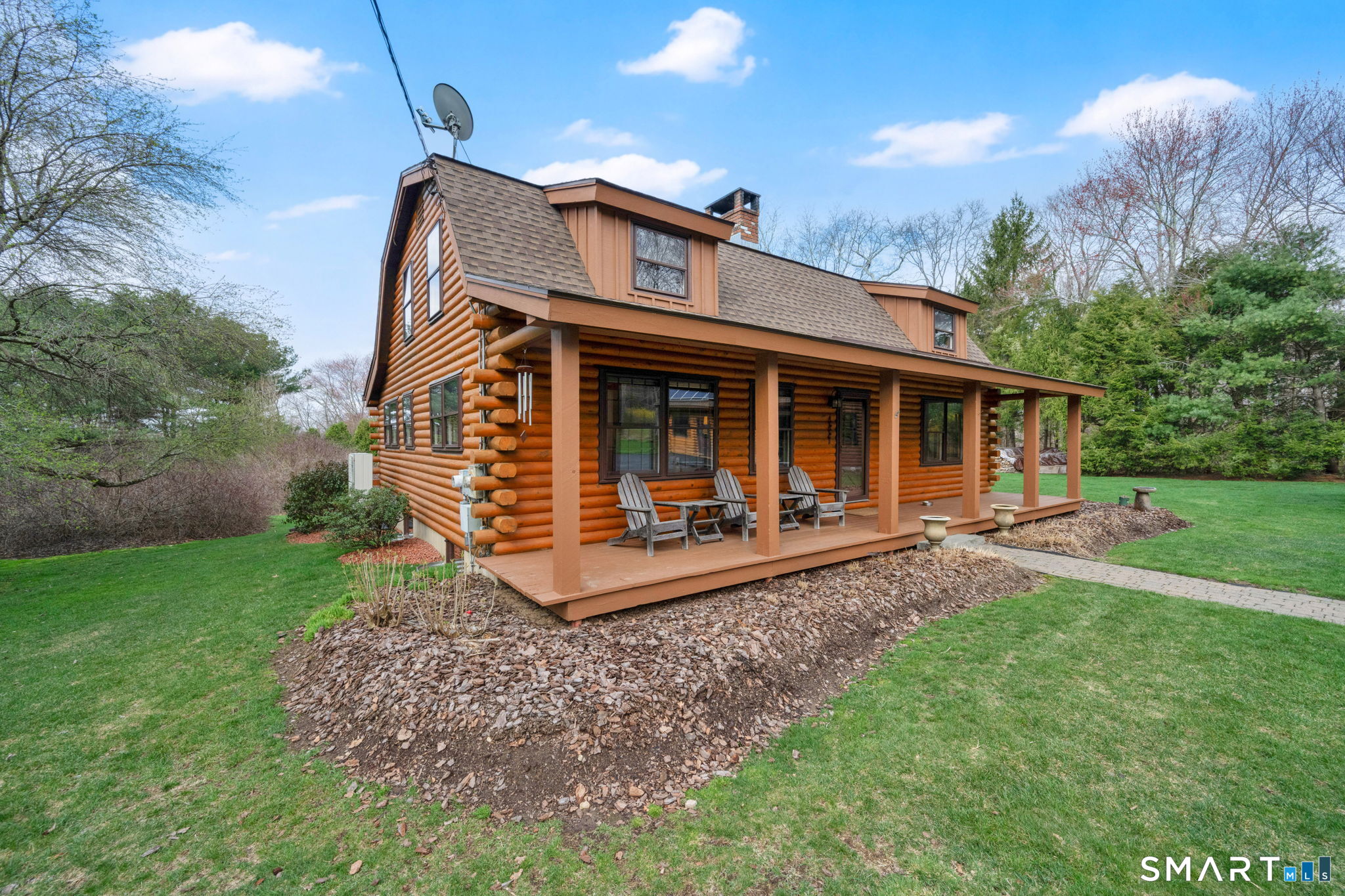 260 West Street Hebron, CT 06248 - Photo 4 of 40 a view of a house with yard and a garden