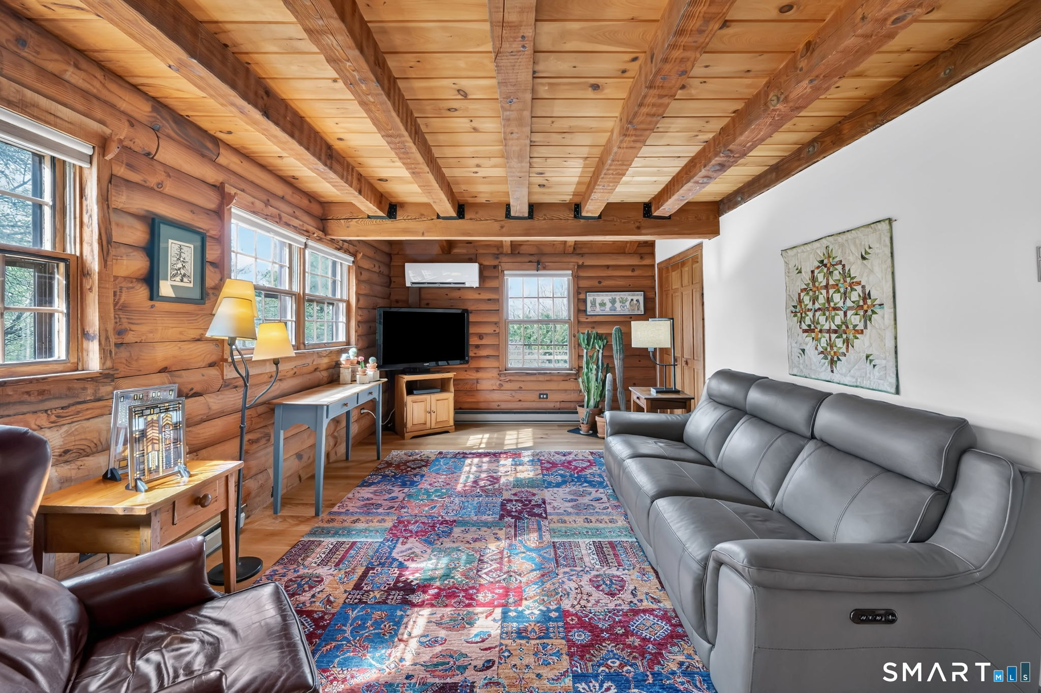 260 West Street Hebron, CT 06248 - Photo 8 of 40 a living room with furniture and a chandelier