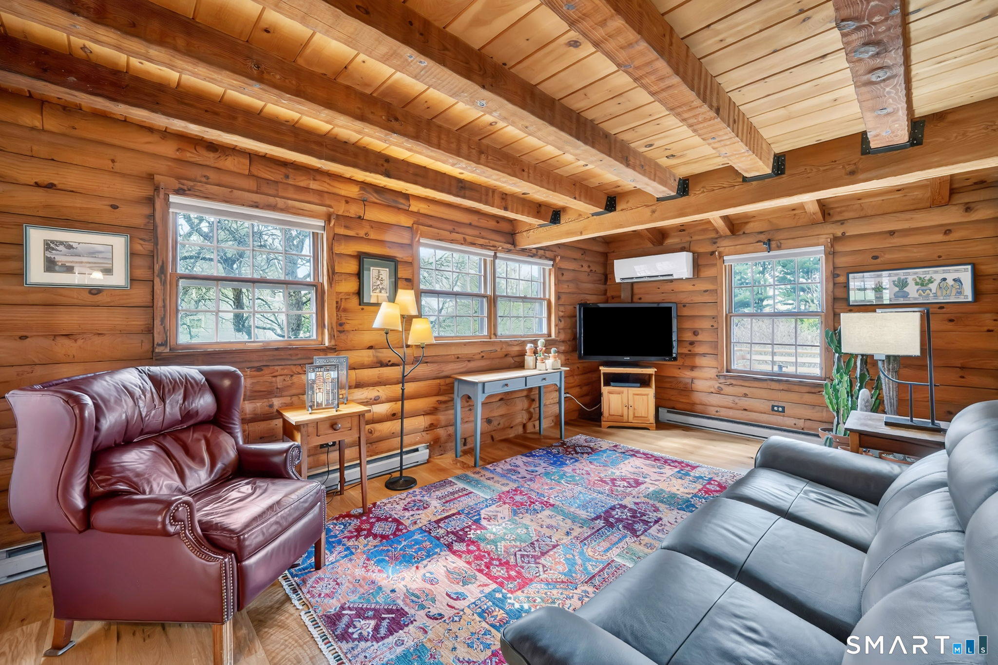 260 West Street Hebron, CT 06248 - Photo 9 of 40 a living room with furniture and a flat screen tv