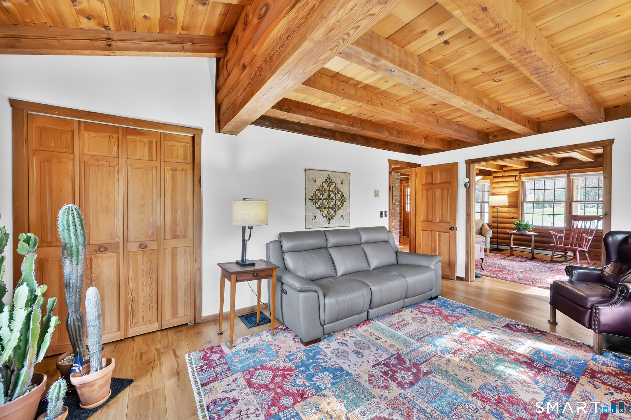 260 West Street Hebron, CT 06248 - Photo 10 of 40 a living room with furniture a wooden floor and next to a window