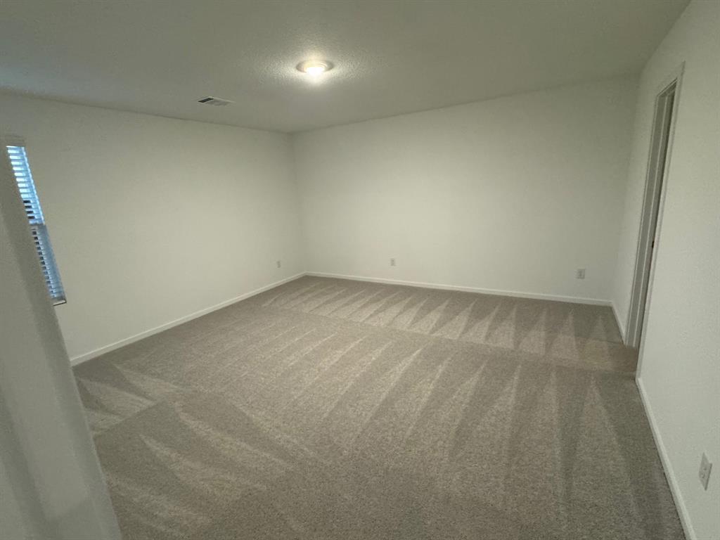 7809 Bent Gale Road Pilot Point, TX 76258 - Photo 11 of 17 an empty room with a bench