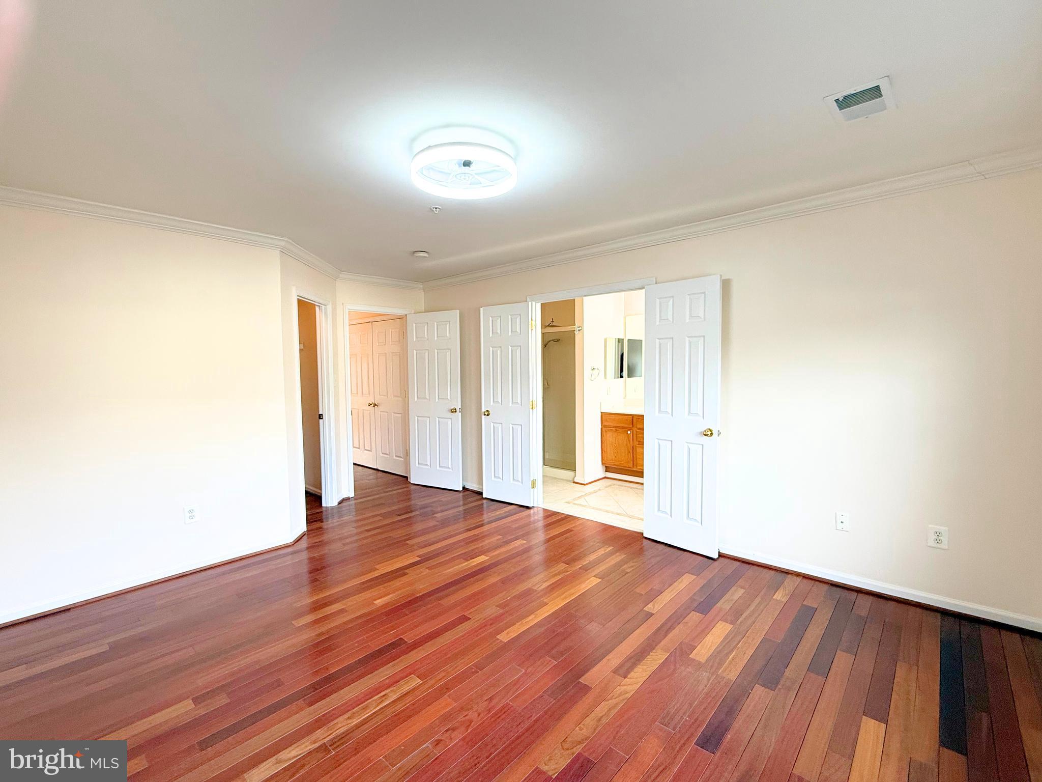 13429 Rising Sun Lane Germantown, MD 20874 - Photo 13 of 27 a view of an empty room with wooden floor and a window