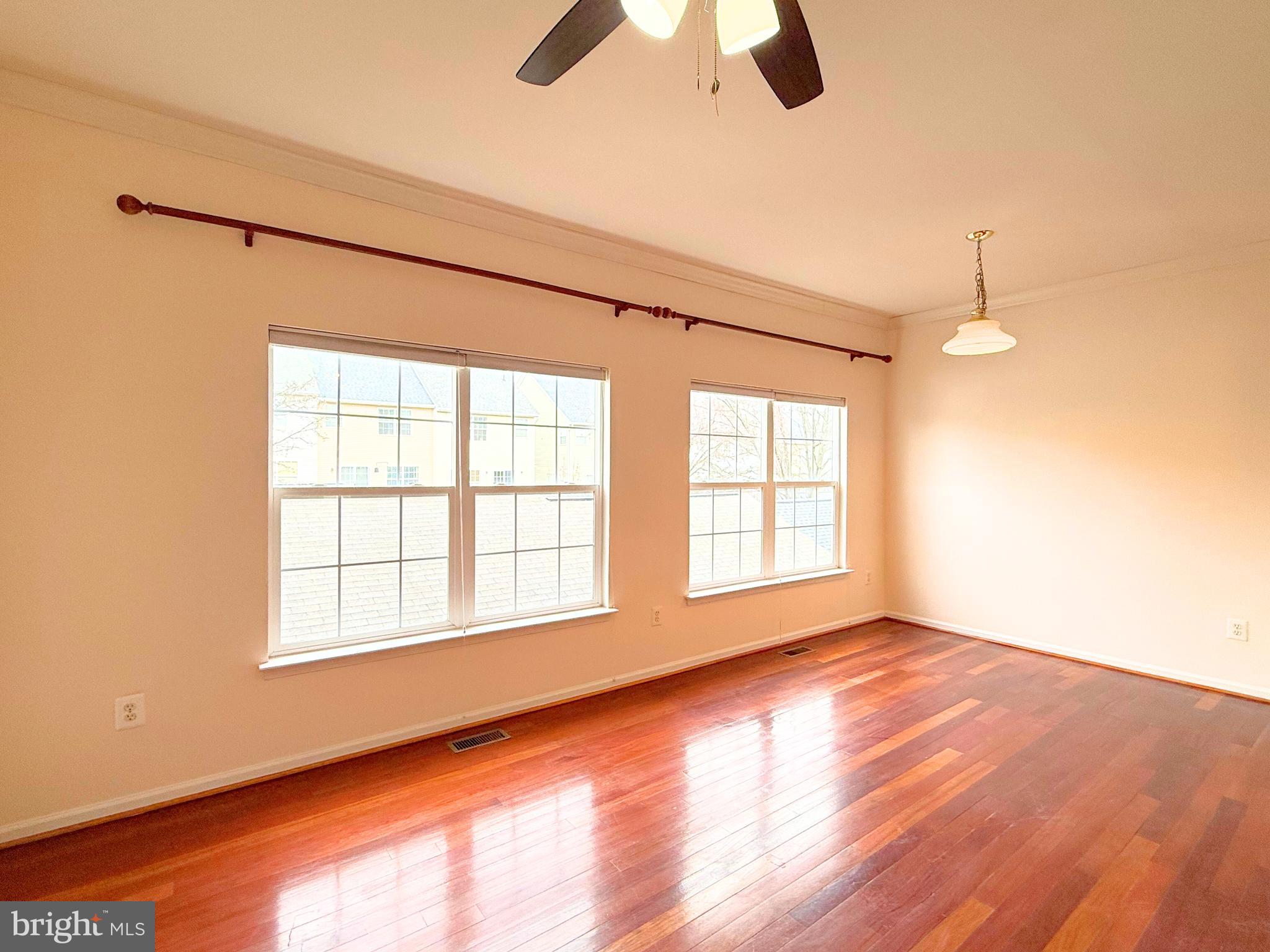 13429 Rising Sun Lane Germantown, MD 20874 - Photo 10 of 27 an empty room with ceiling fan and window