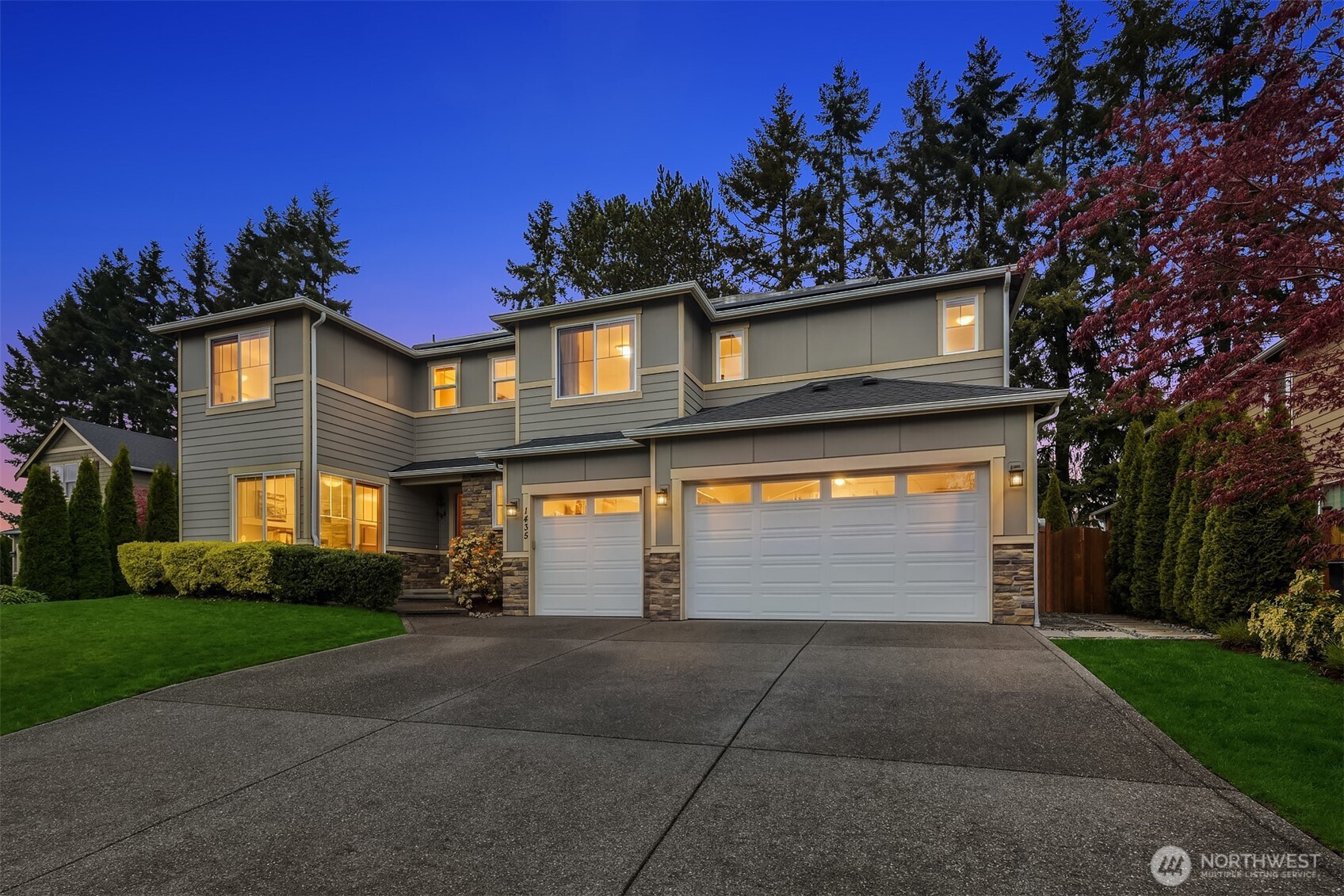 1435 242nd Place Southeast Bothell, WA 98021 - Photo 2 of 40 a front view of a house with garden