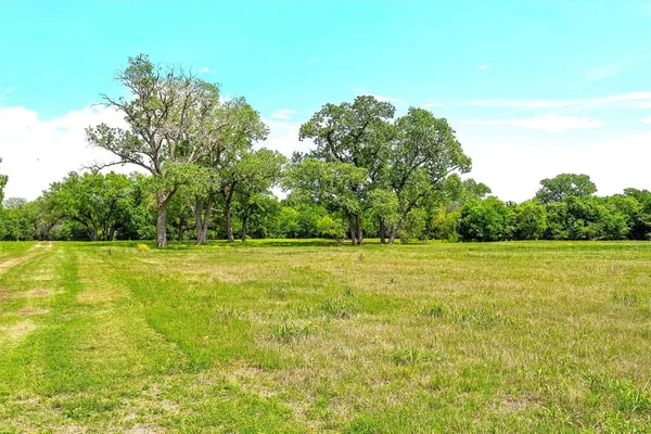 a view of a lake with houses in the back