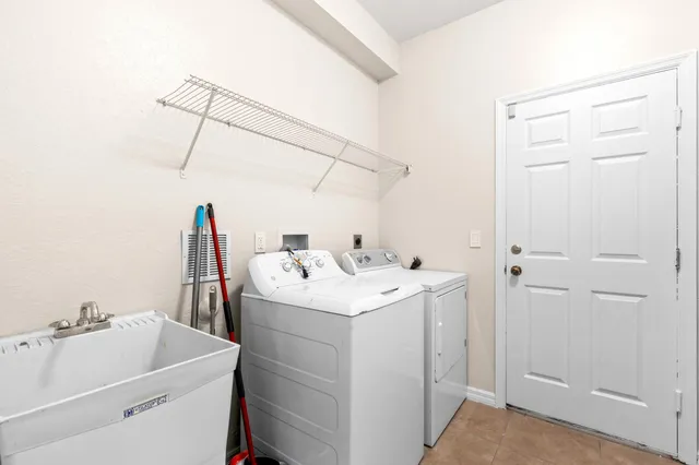 a utility room with dryer and washer