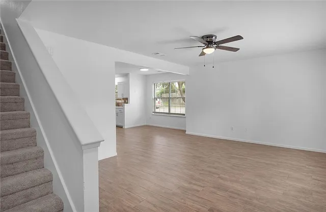 a view of an empty room with a window