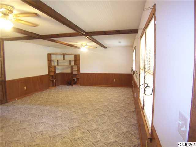 409 Robinson Creek Road Bostic, NC 28018 - Photo 2 of 9 a view of an empty room with a window