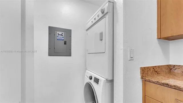 a view of storage and utility room with washer and dryer