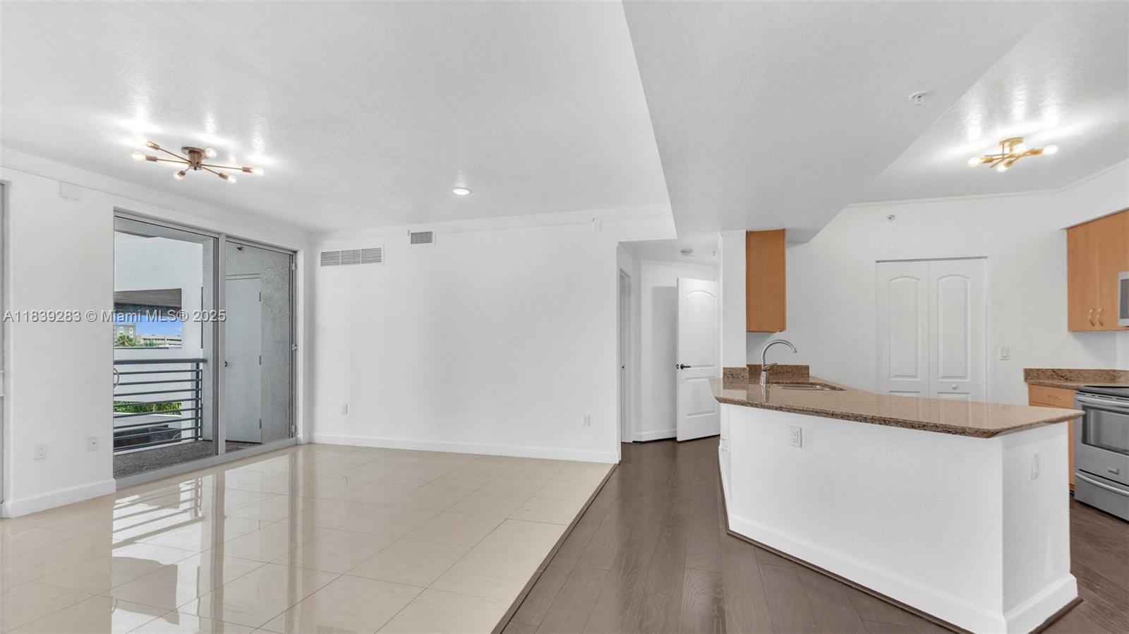 1830 Radius Drive, Unit 405 Hollywood, FL 33020 - Photo 10 of 28 a view of a kitchen cabinets and a sink