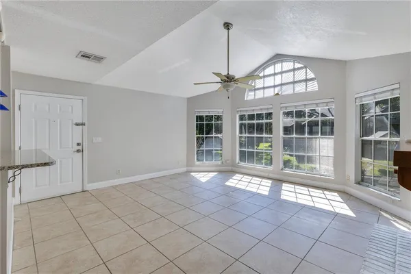 a view of an empty room with a chandelier