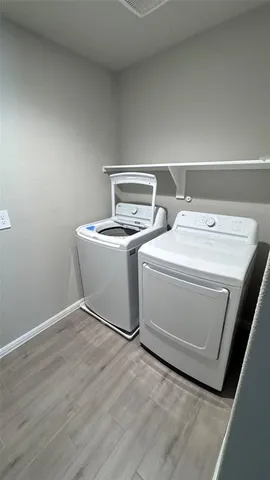 a utility room with dryer and washer