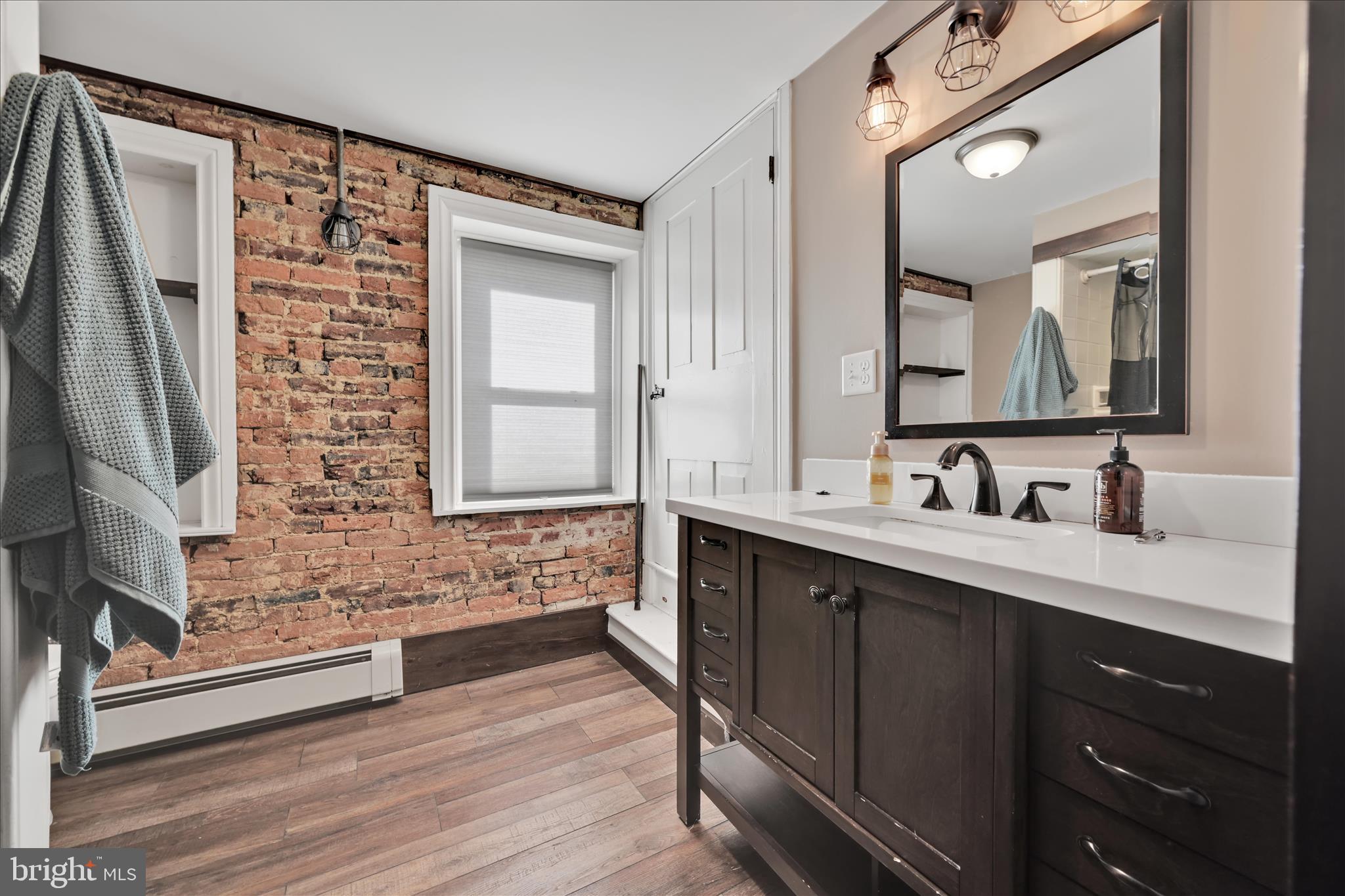 116 Mill Road Bernville, PA 19506 - Photo 17 of 62 a bathroom with a double vanity sink a mirror and a shower