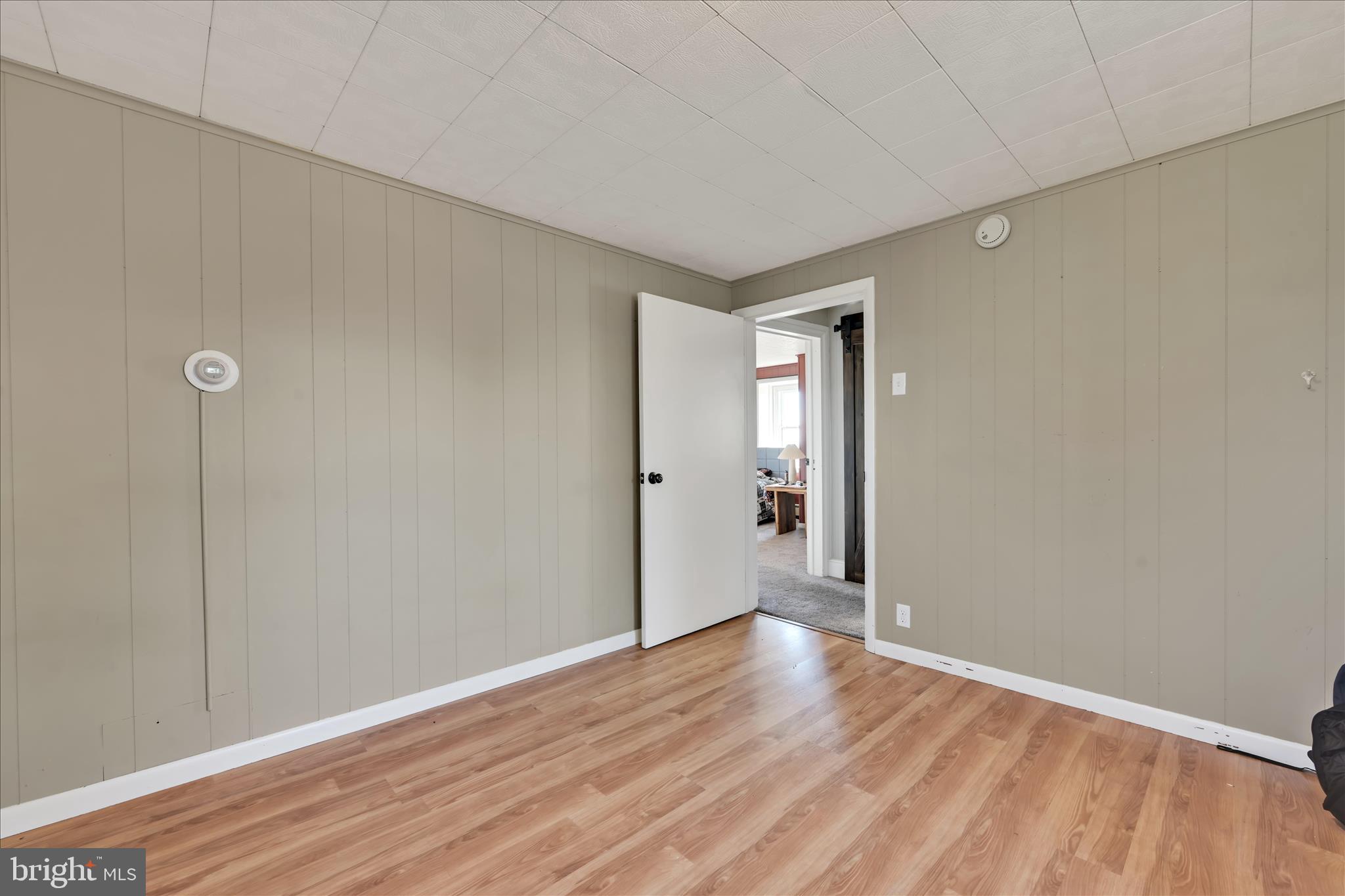 116 Mill Road Bernville, PA 19506 - Photo 21 of 62 a view of an empty room with wooden floor