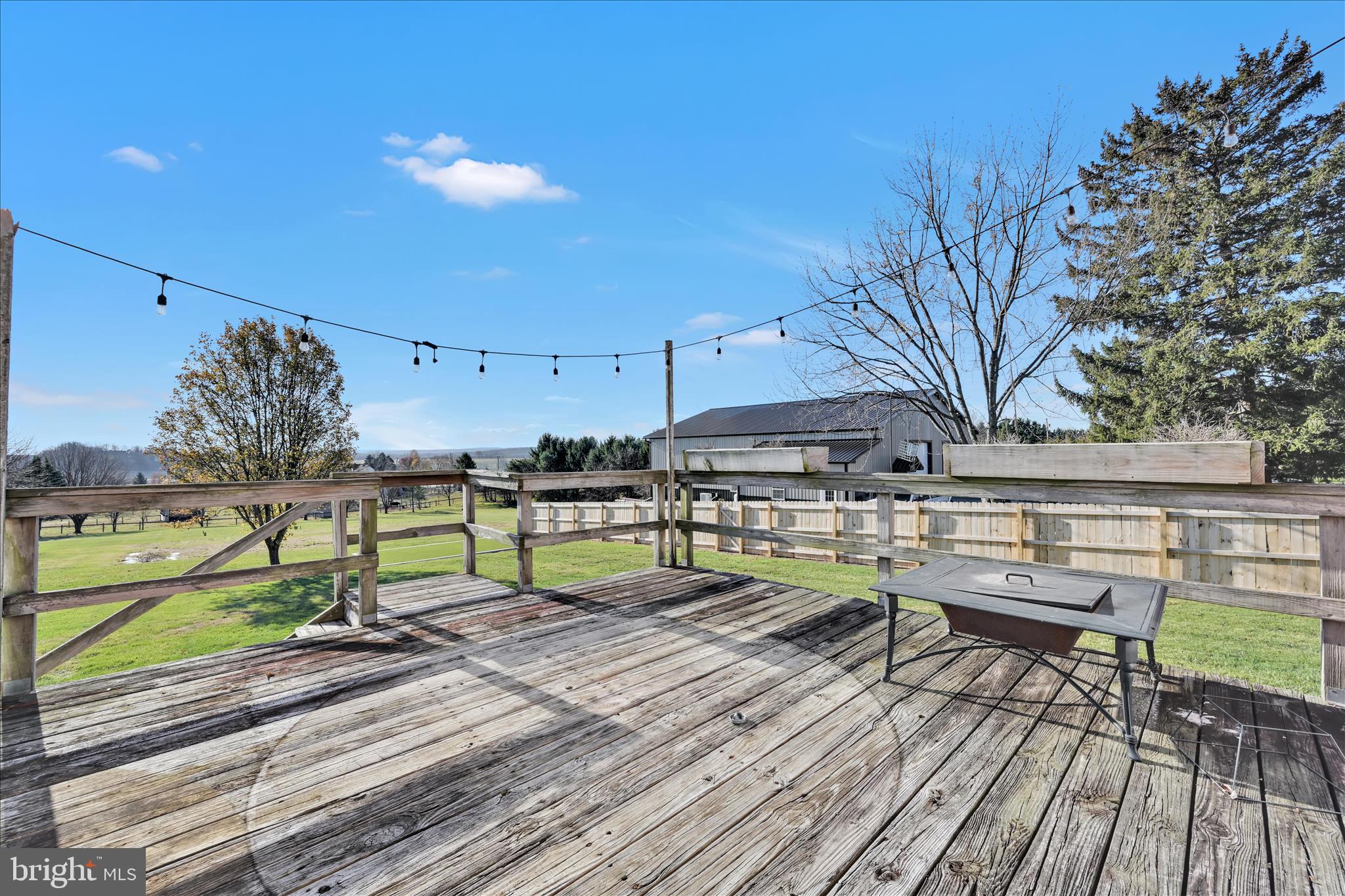 116 Mill Road Bernville, PA 19506 - Photo 22 of 62 a view of a chairs and table on the wooden deck