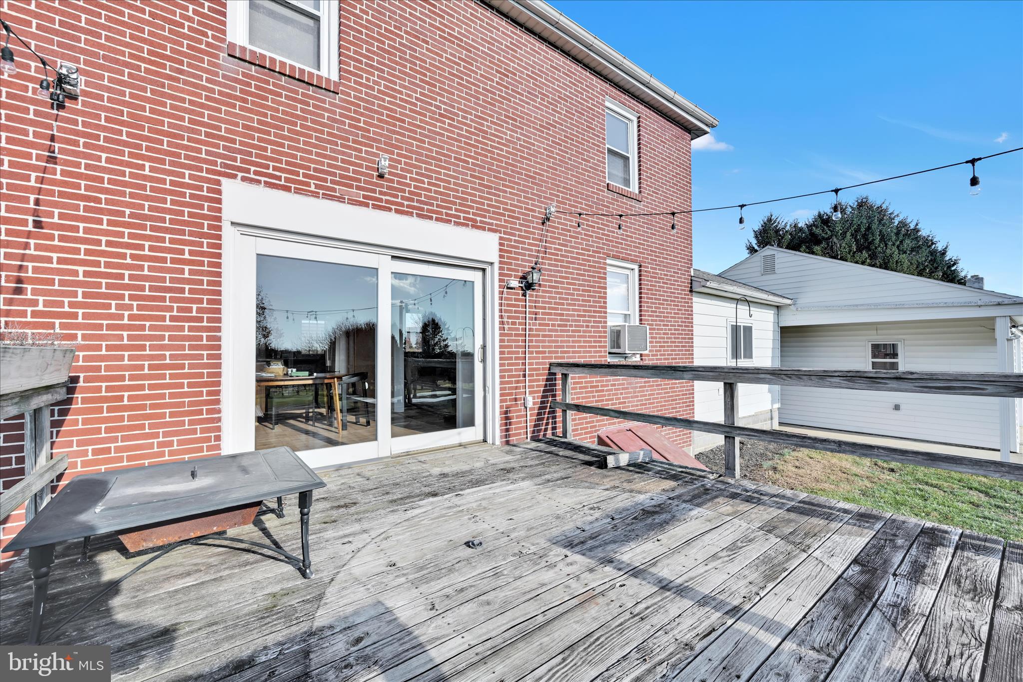 116 Mill Road Bernville, PA 19506 - Photo 23 of 62 a front view of a house with a wooden bench