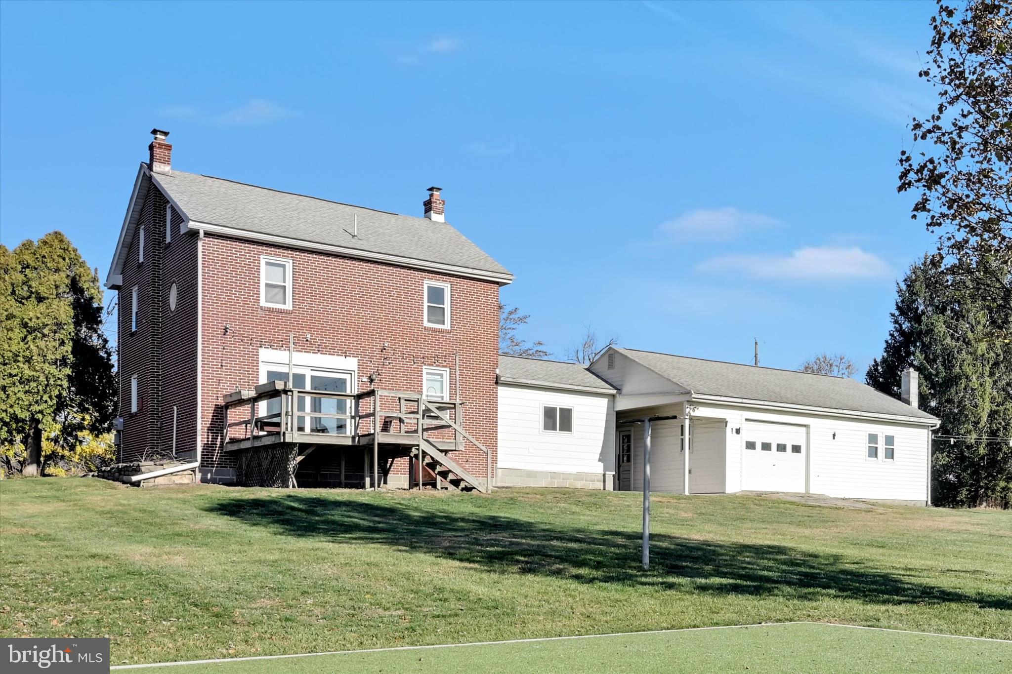 116 Mill Road Bernville, PA 19506 - Photo 31 of 62 a front view of a house with a yard and garage