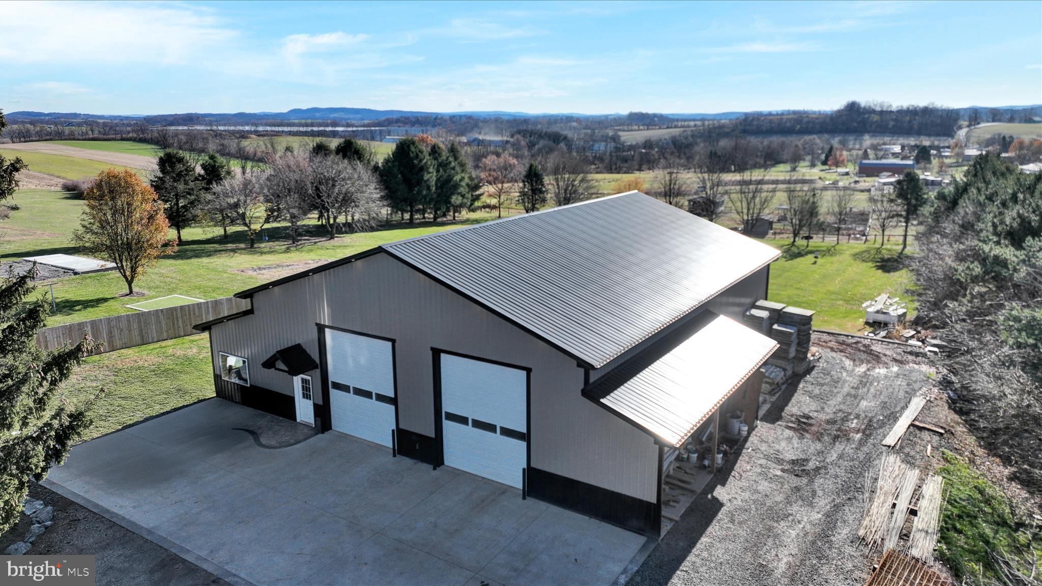 116 Mill Road Bernville, PA 19506 - Photo 56 of 62 a terrace of a house with outdoor seating and lake view
