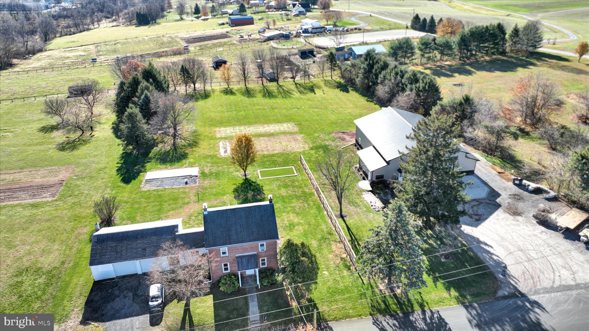 116 Mill Road Bernville, PA 19506 - Photo 58 of 62 an aerial view of a house with a garden and lots of trees