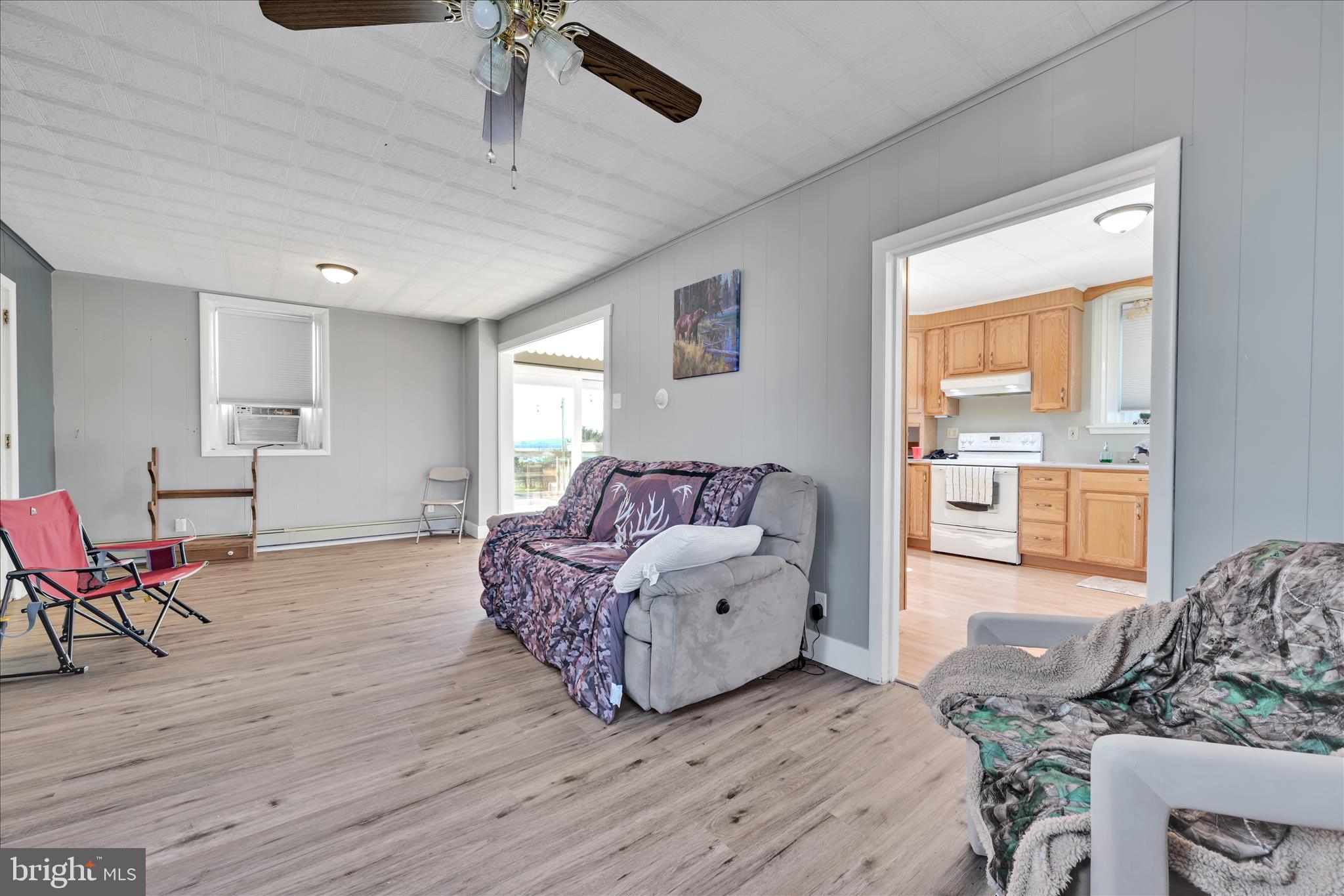 116 Mill Road Bernville, PA 19506 - Photo 9 of 62 a spacious bedroom with a bed and wooden floor