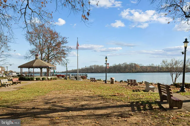 a view of a lake with boats in the ocean