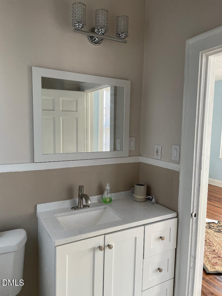 1609 Main Street Scotland Neck, NC 27874 - Photo 20 of 24 a bathroom with a sink and a toilet
