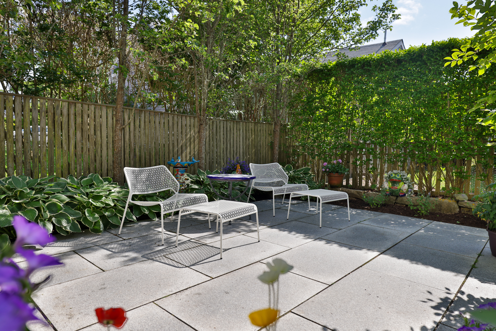 12 Hussey Street Nantucket, MA 02554 - Photo 38 of 47 a view of a lounge chairs in the backyard of a house