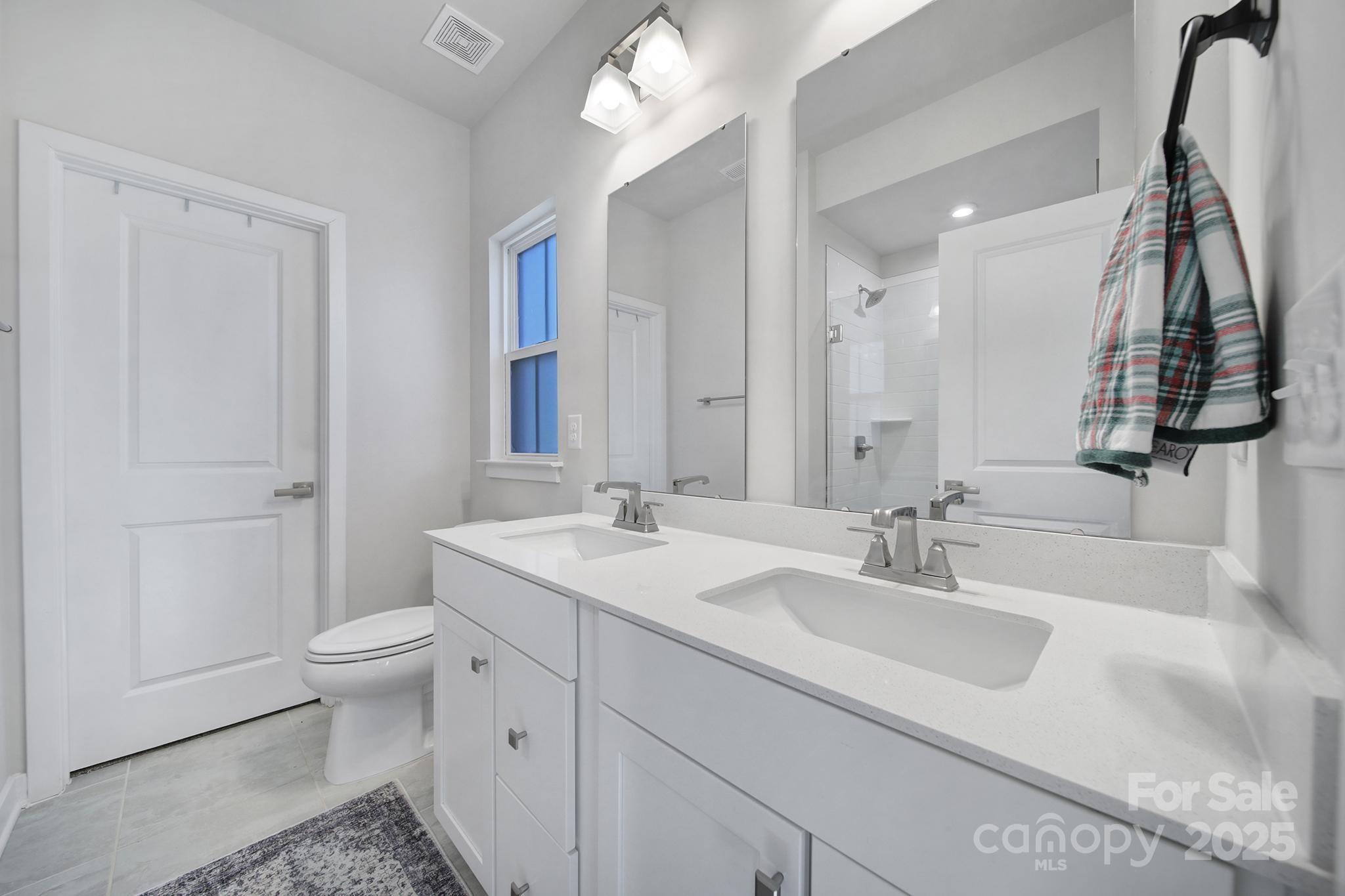 6120 Sta Xing Avenue Charlotte, NC 28217 - Photo 15 of 31 a bathroom with a sink and a mirror