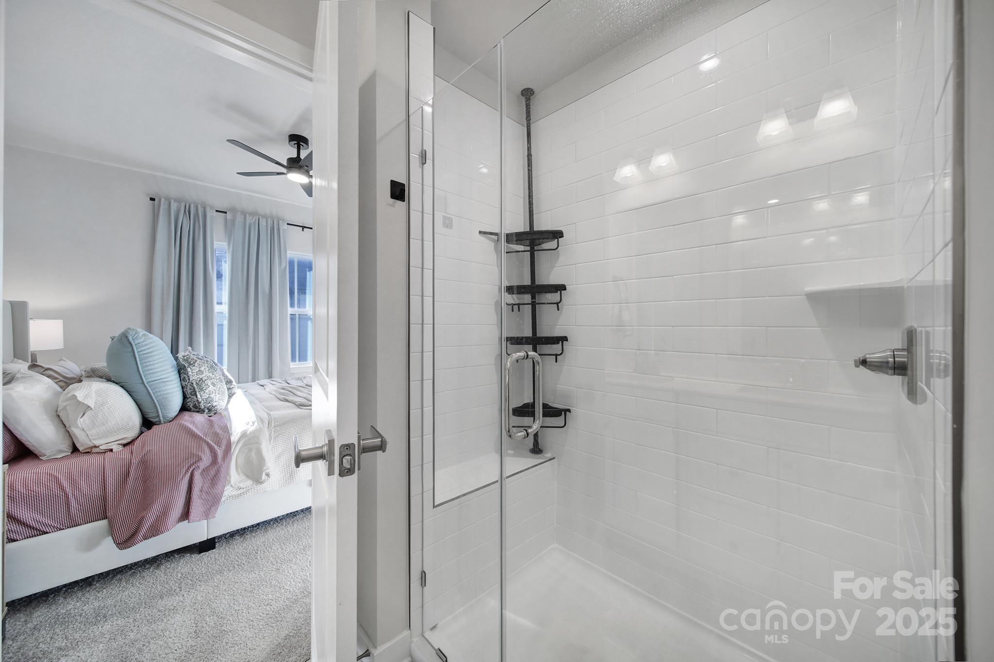 6120 Sta Xing Avenue Charlotte, NC 28217 - Photo 16 of 31 a spacious bathroom with a bathtub and shower