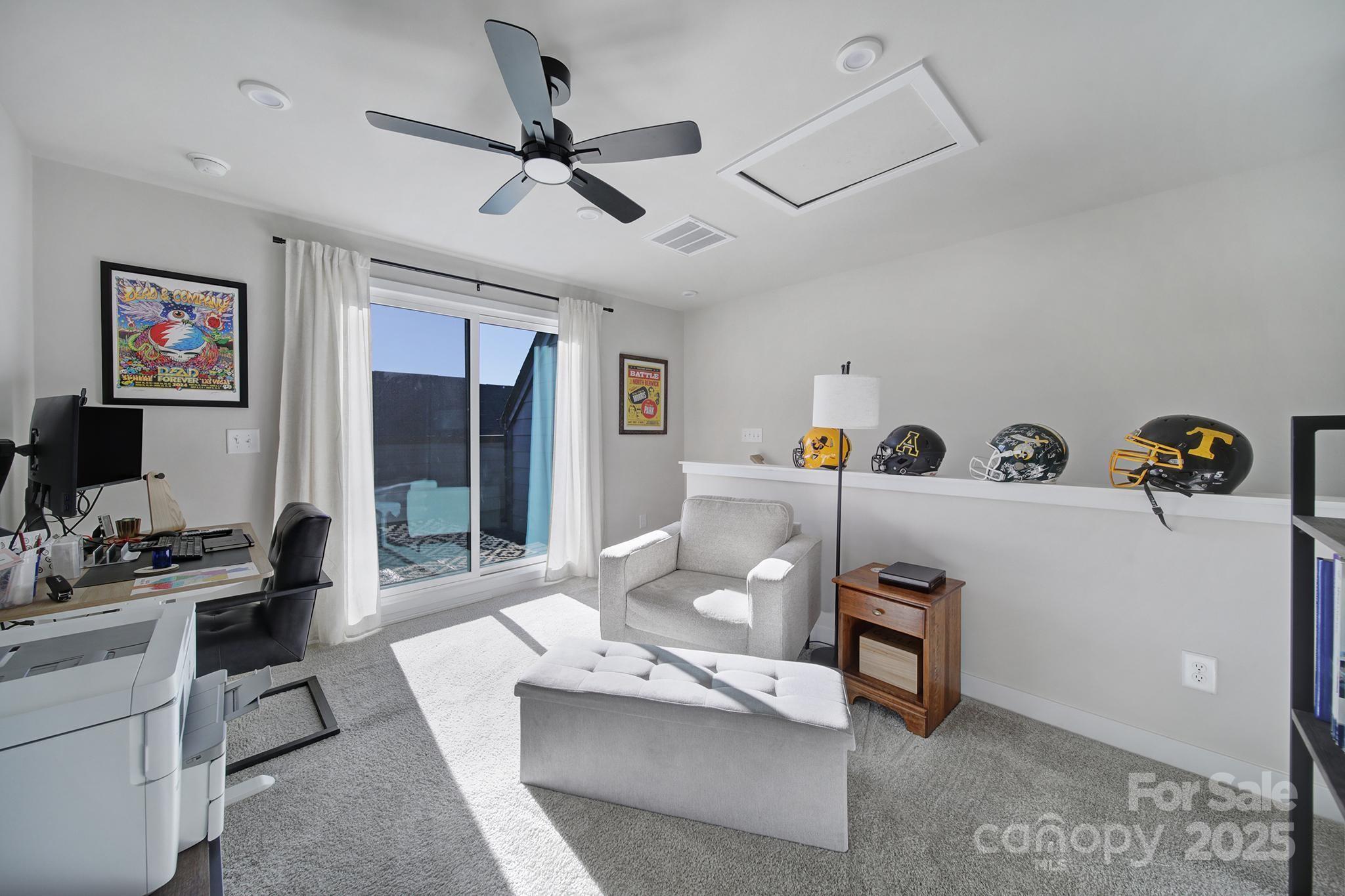 6120 Sta Xing Avenue Charlotte, NC 28217 - Photo 21 of 31 a living room with furniture and a flat screen tv