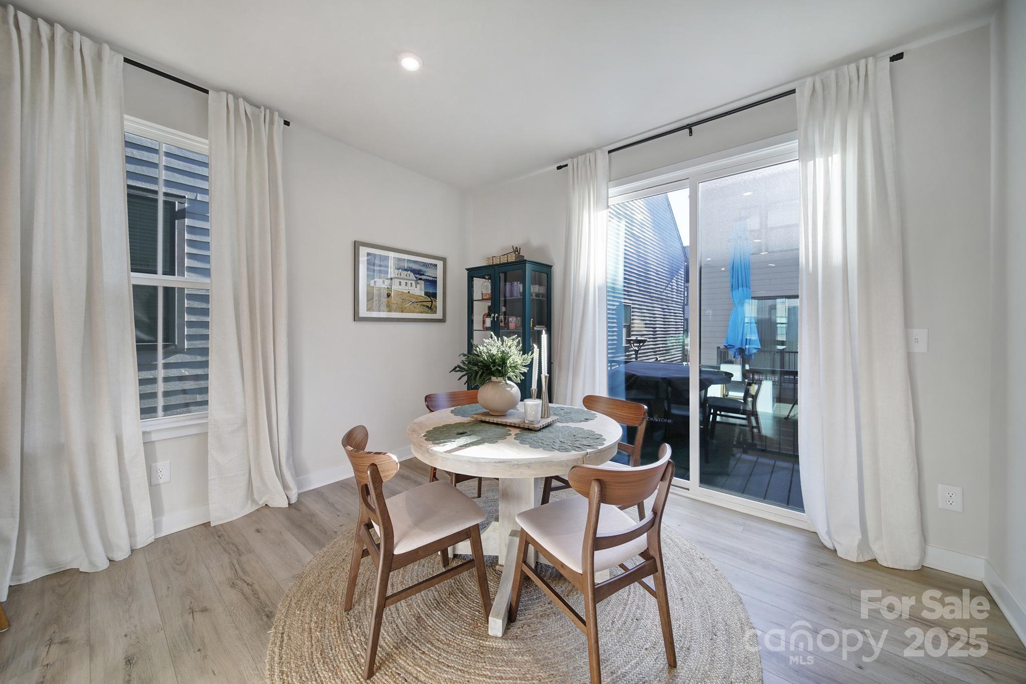 6120 Sta Xing Avenue Charlotte, NC 28217 - Photo 3 of 31 a dining room with furniture and window