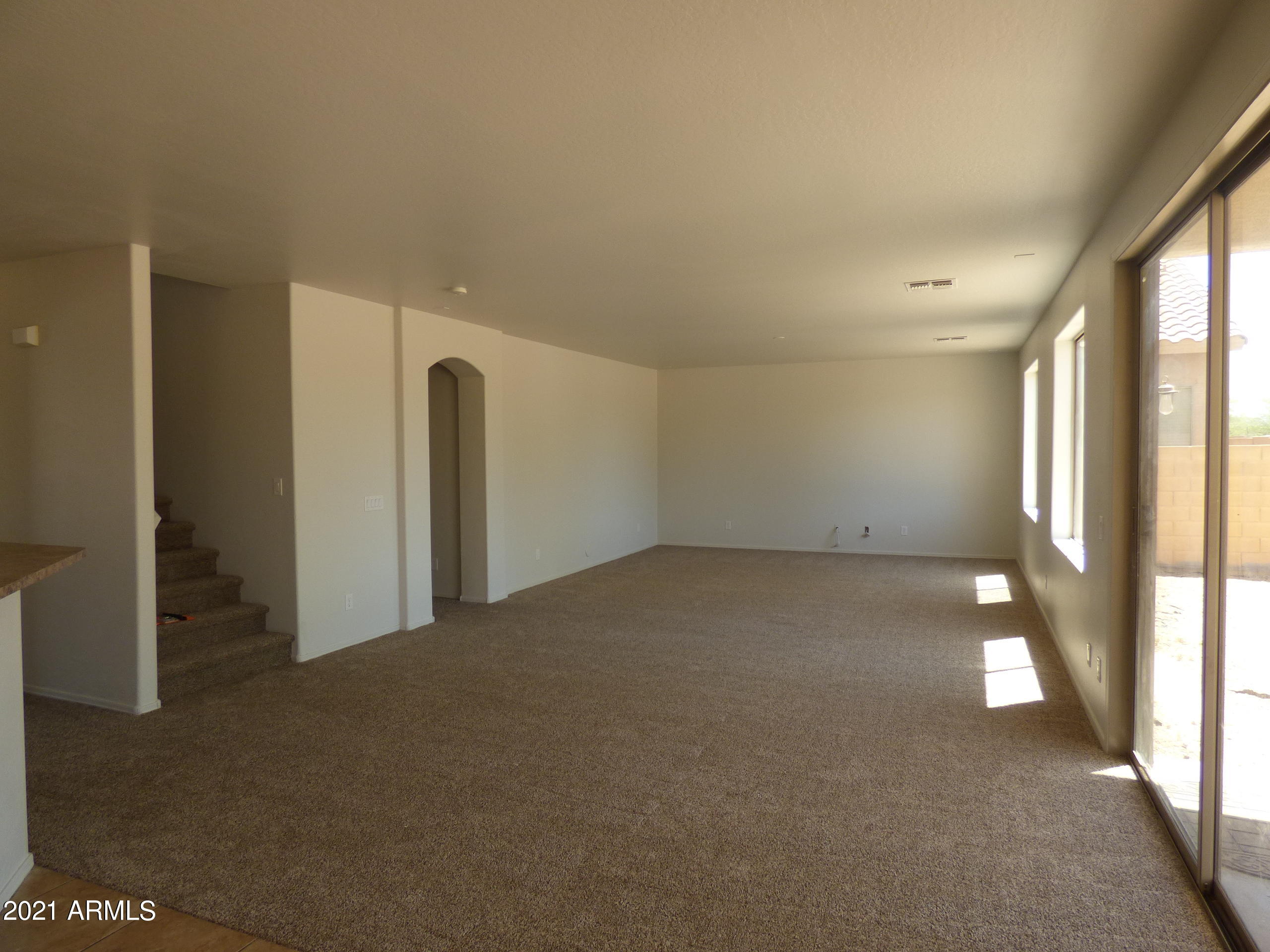 5617 West Carson Road Laveen, AZ 85339 - Photo 11 of 56 a view of an empty room and a window
