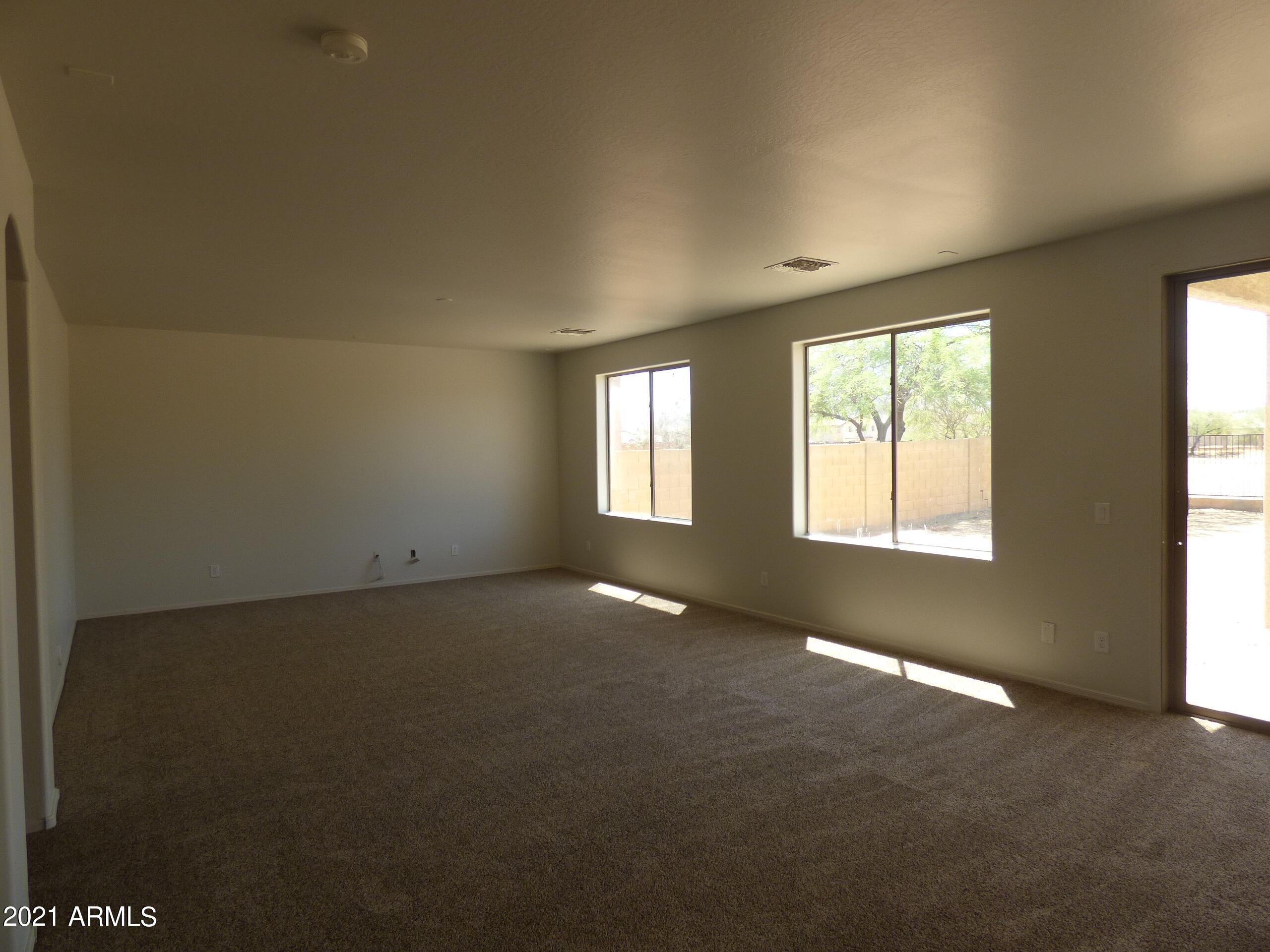 5617 West Carson Road Laveen, AZ 85339 - Photo 13 of 56 an empty room with windows