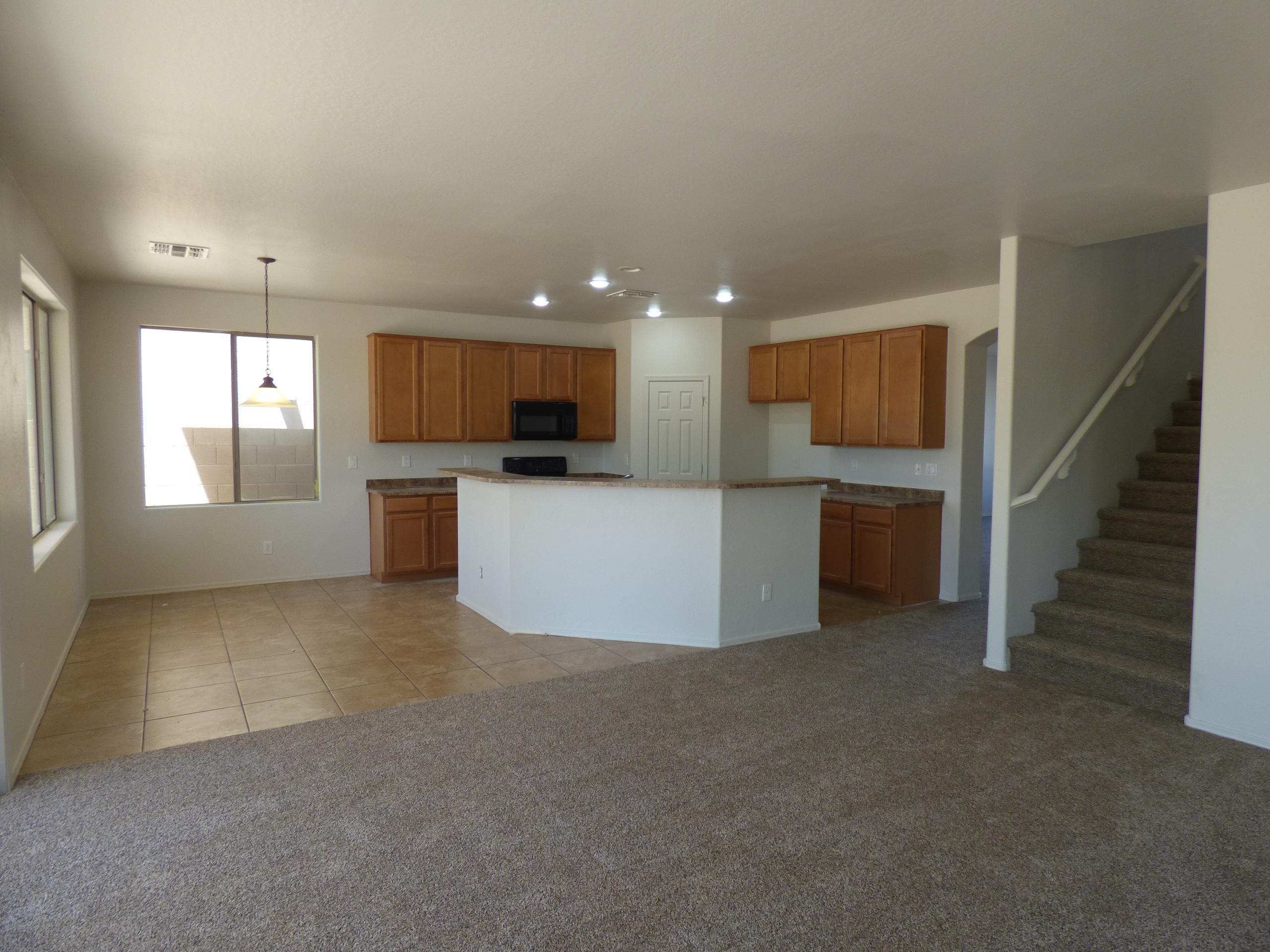 5617 West Carson Road Laveen, AZ 85339 - Photo 16 of 56 a view of a kitchen with a sink cabinets and a kitchen