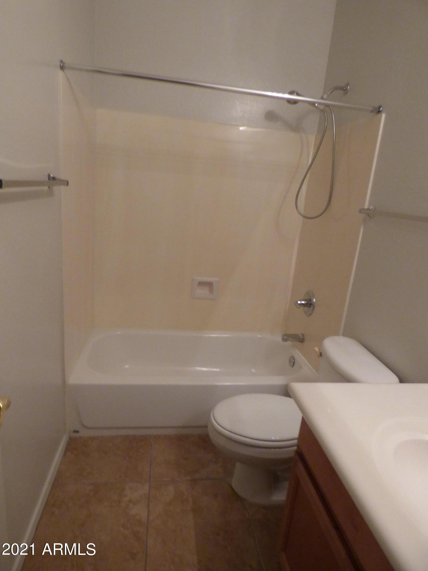 5617 West Carson Road Laveen, AZ 85339 - Photo 19 of 56 a bathroom with a shower a toilet and a shower