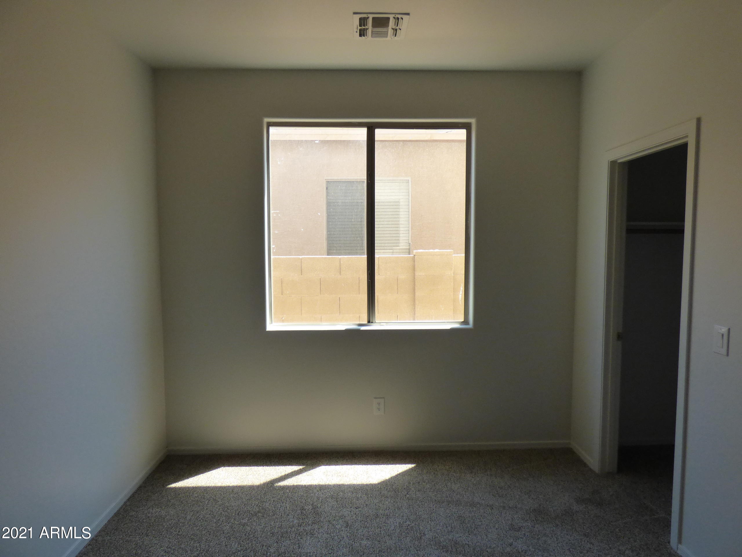 5617 West Carson Road Laveen, AZ 85339 - Photo 20 of 56 an empty room with a window