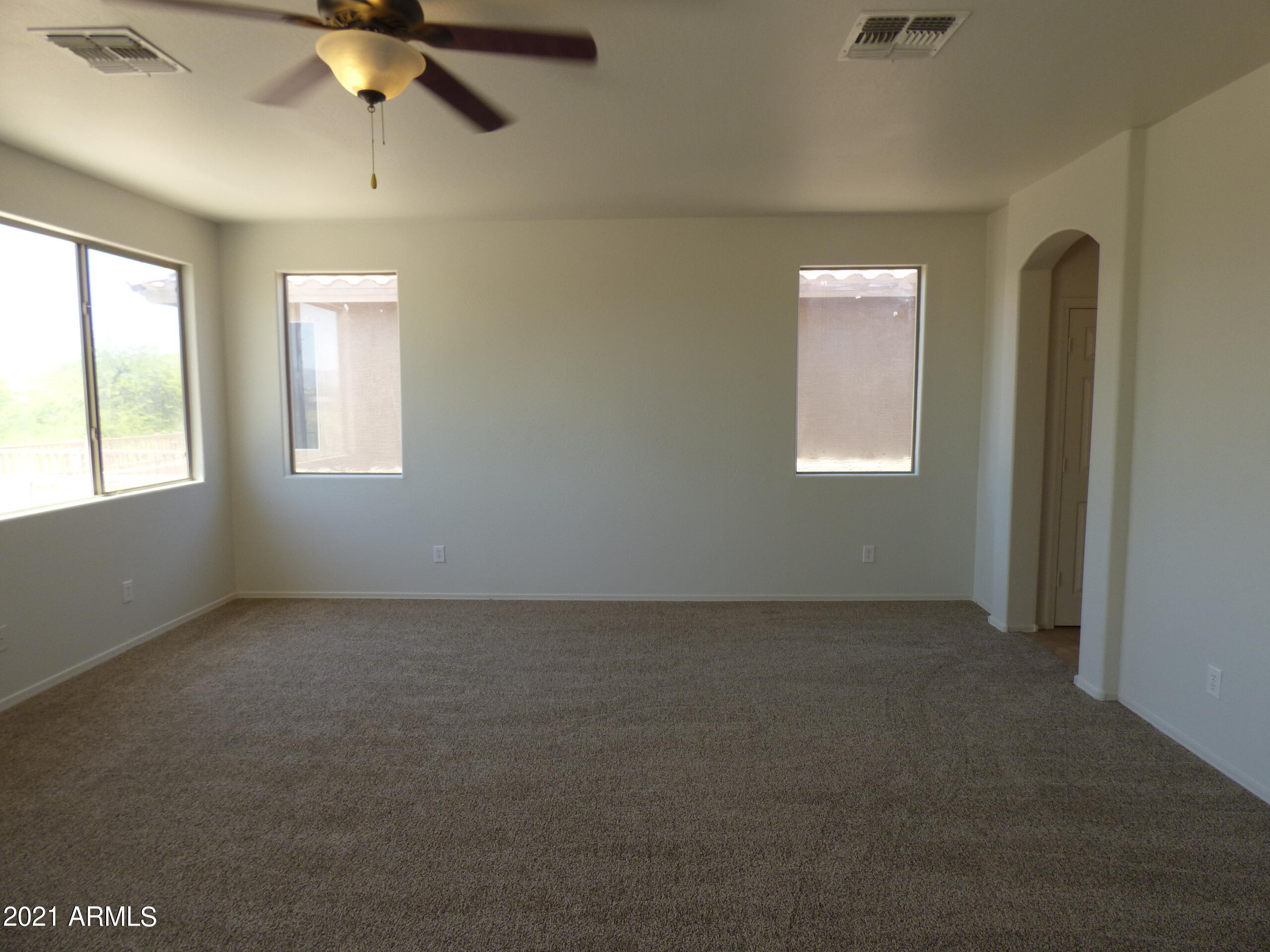 5617 West Carson Road Laveen, AZ 85339 - Photo 23 of 56 an empty room with windows