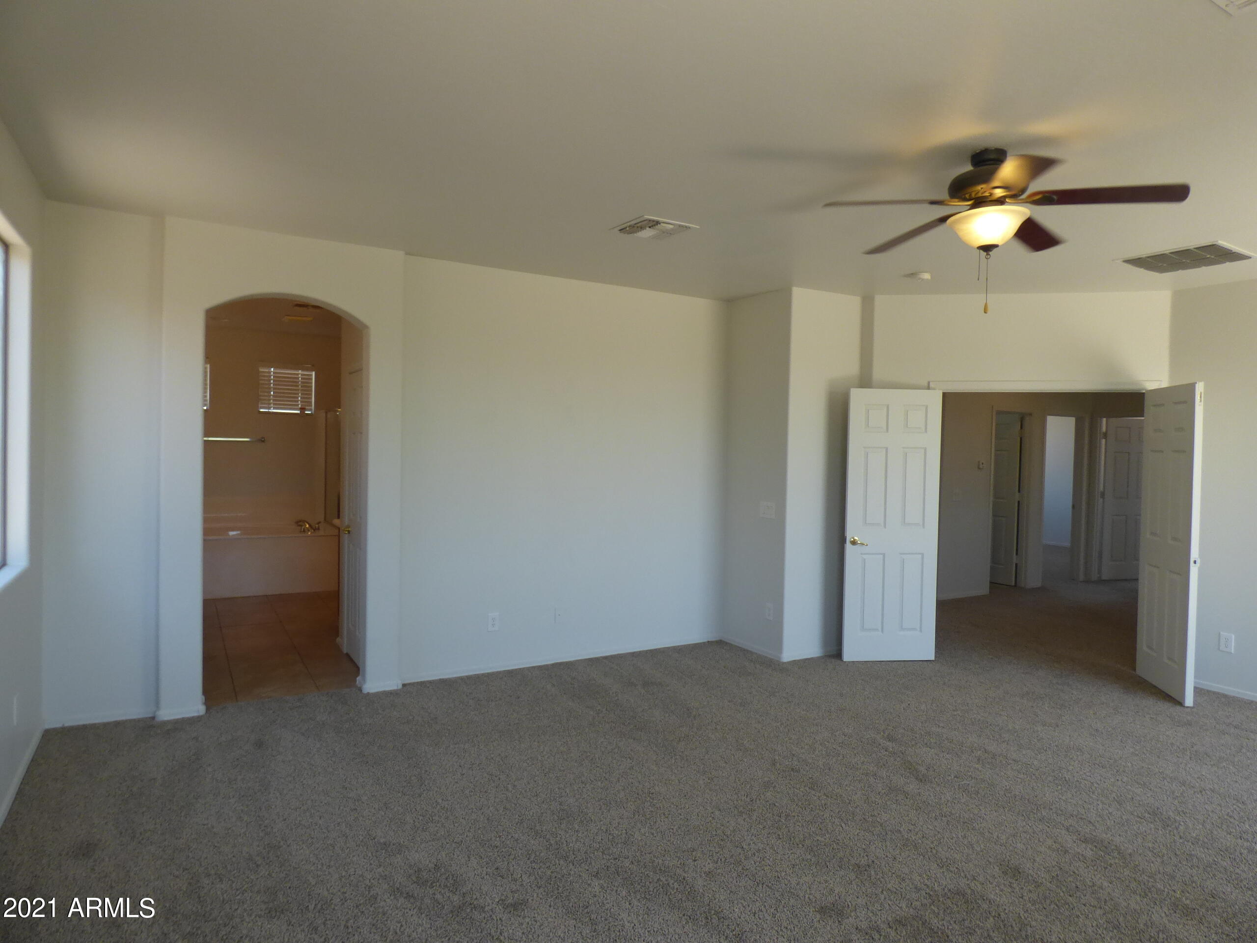 5617 West Carson Road Laveen, AZ 85339 - Photo 24 of 56 a view of a room with a ceiling fan