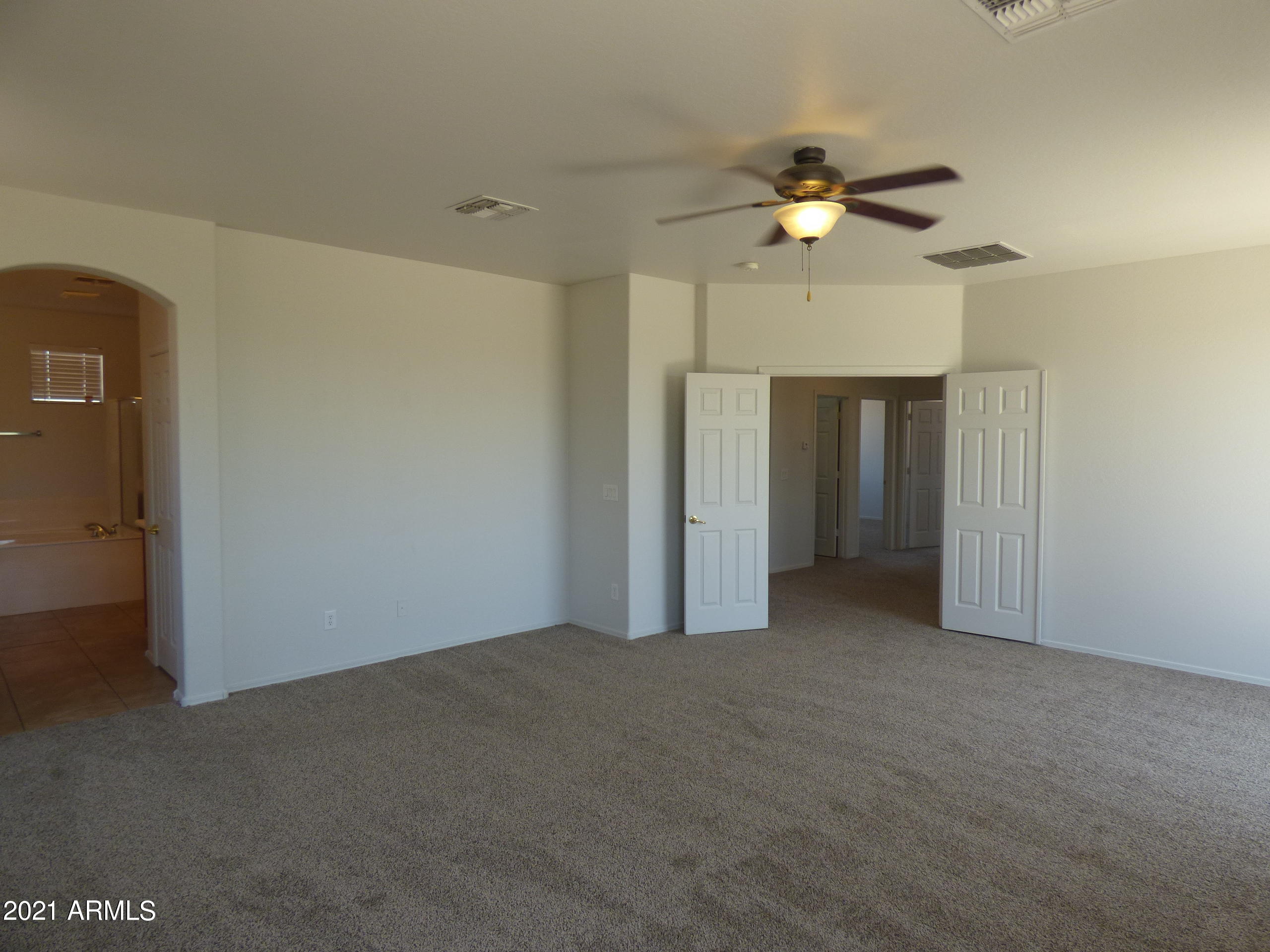 5617 West Carson Road Laveen, AZ 85339 - Photo 26 of 56 a view of a livingroom with a ceiling fan & chandelier fan