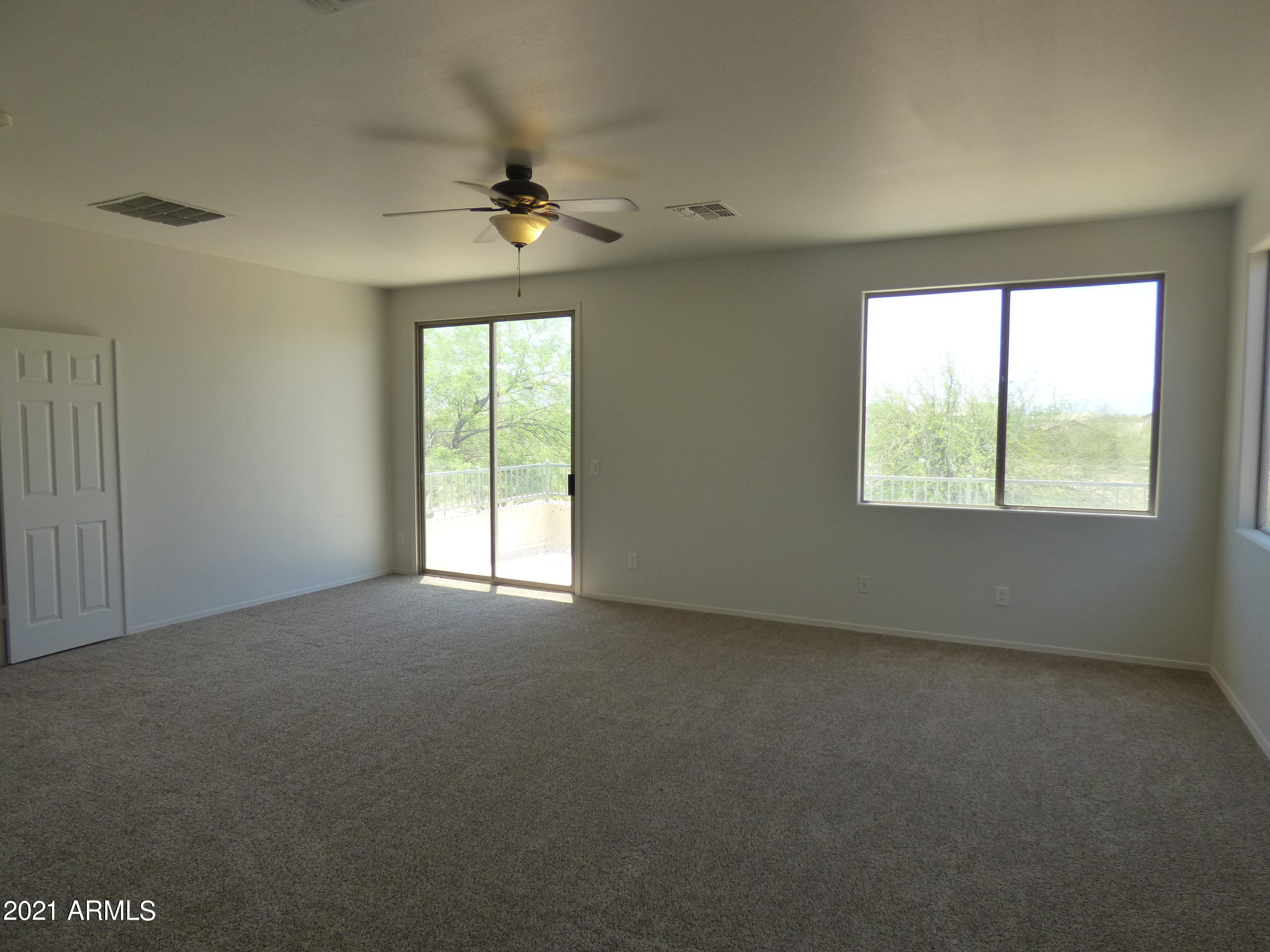 5617 West Carson Road Laveen, AZ 85339 - Photo 28 of 56 a view of an empty room with a window