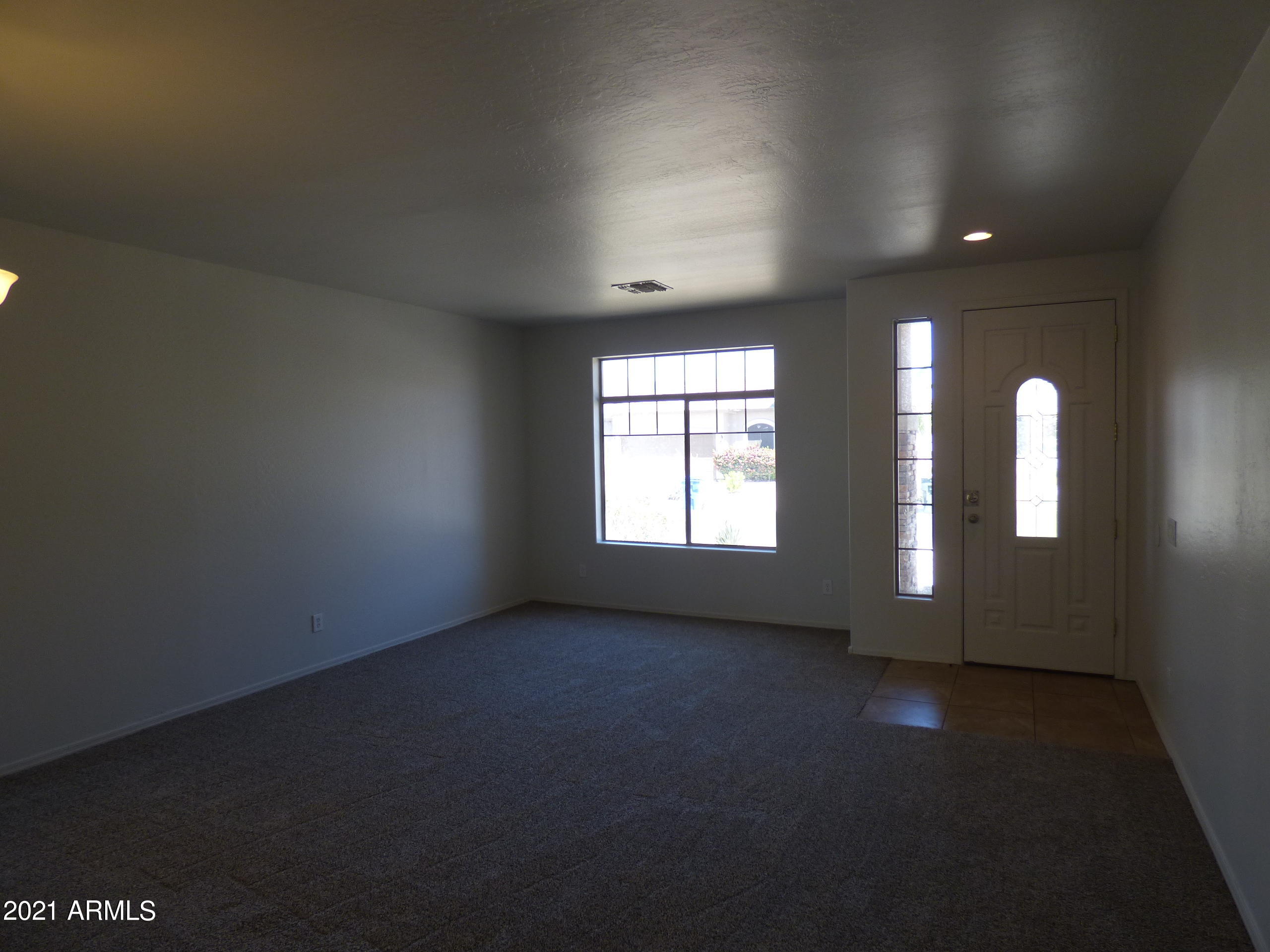5617 West Carson Road Laveen, AZ 85339 - Photo 3 of 56 an empty room with windows